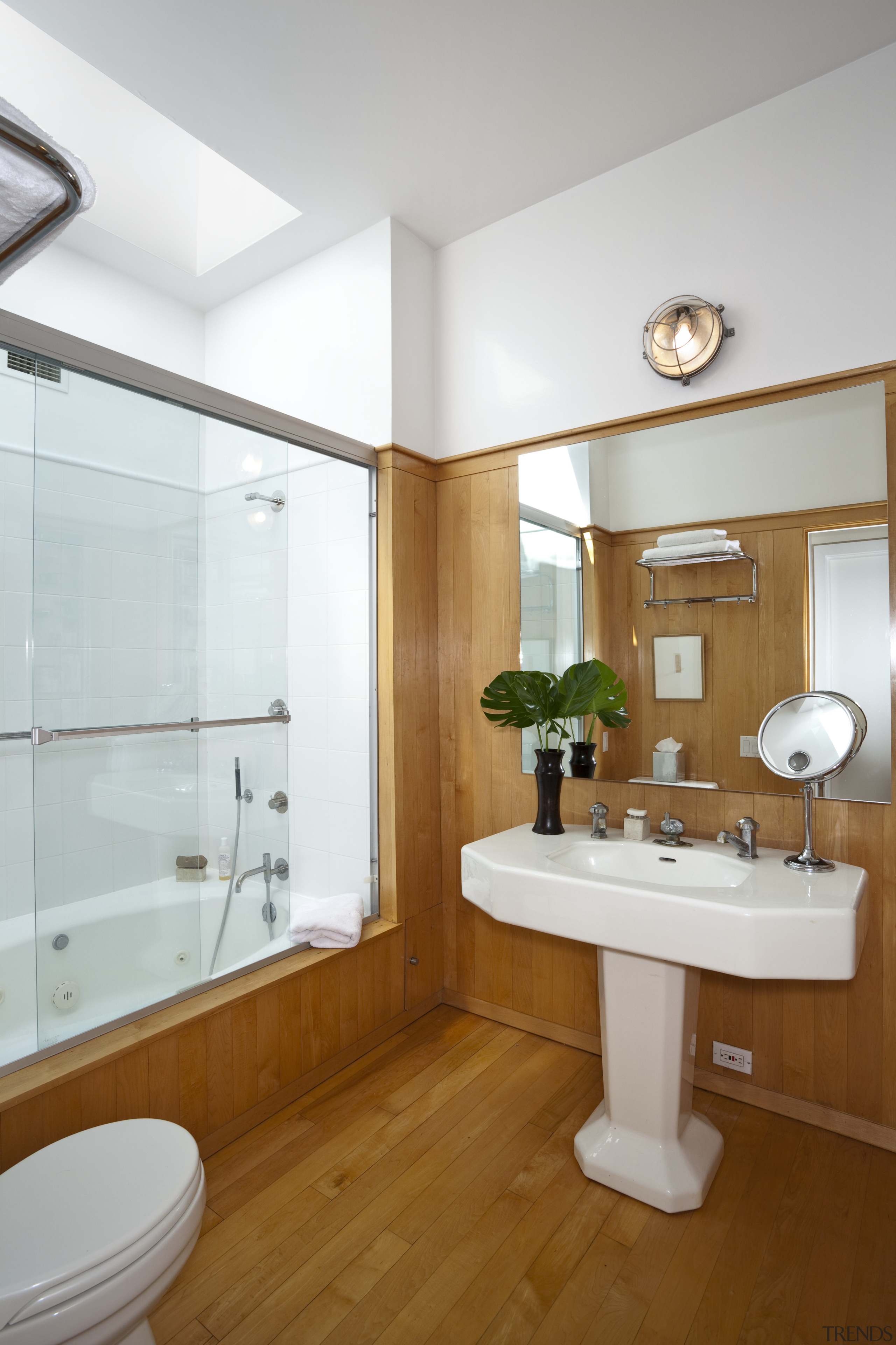 View of this contemporary home remodeled by Eleven bathroom, floor, home, interior design, plumbing fixture, property, real estate, room, sink, white, brown, gray