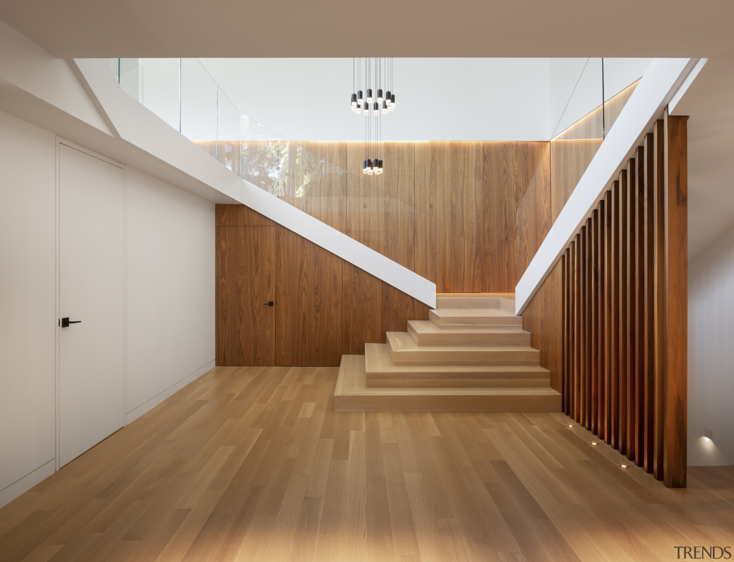 Understated lighting further accentuates the home's central focus. 