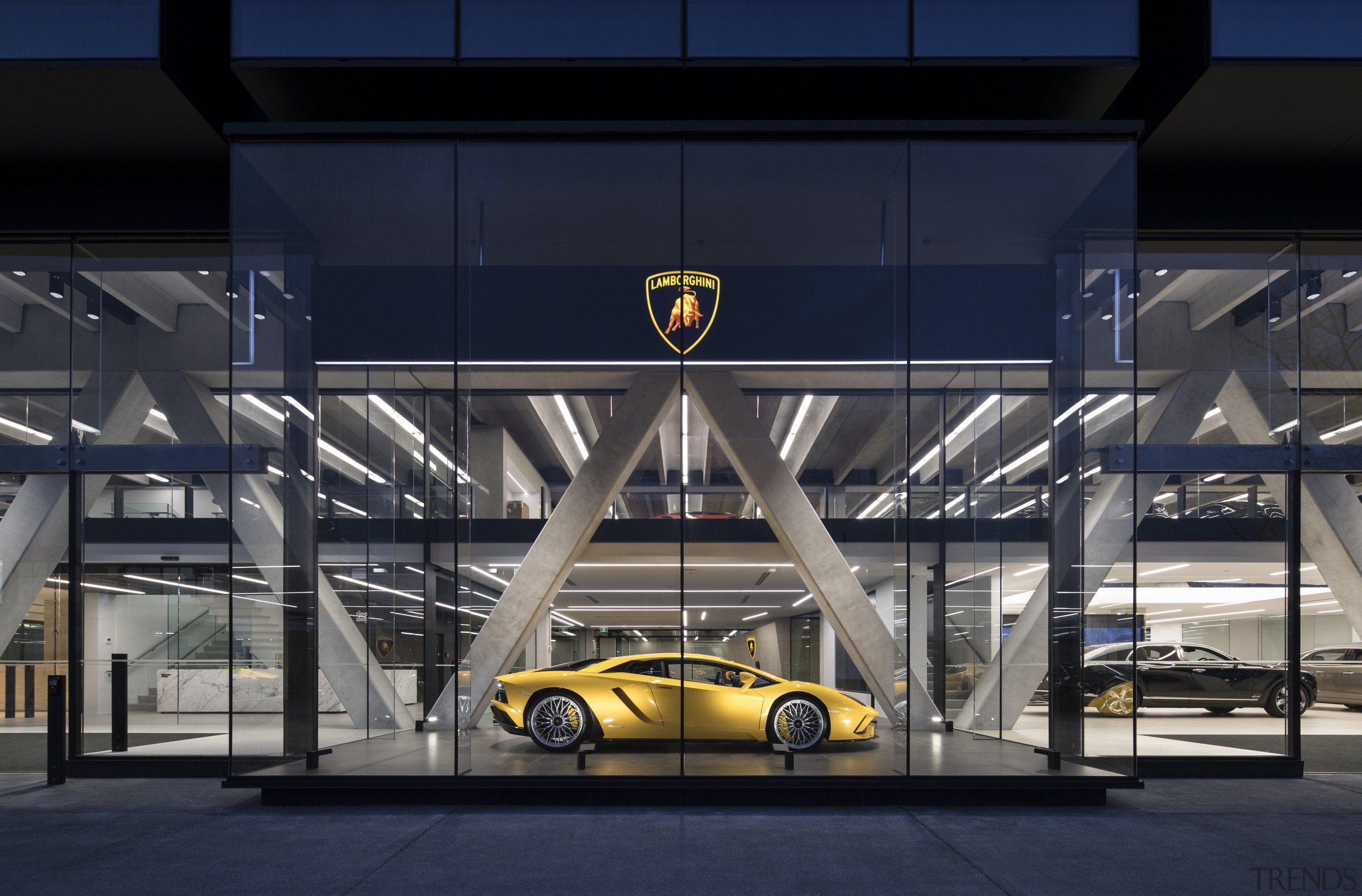 Warren and Mahoney Architects principal Jonathan Hewlett says architecture, automotive design, building, car, car dealership, motor vehicle, sports car, structure, technology, vehicle, yellow, blue