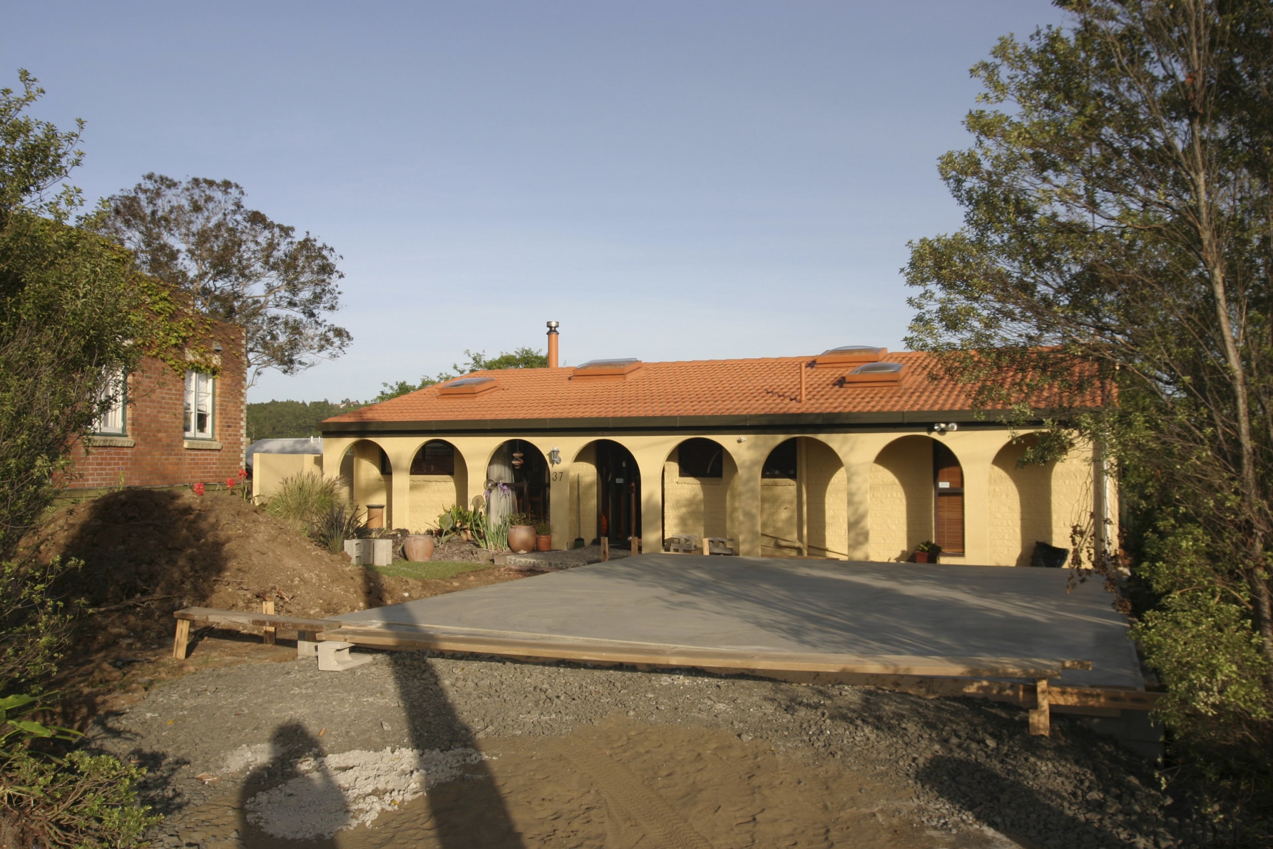 Exterior view of house prior to renovations where estate, facade, hacienda, historic site, home, house, property, real estate, villa, brown