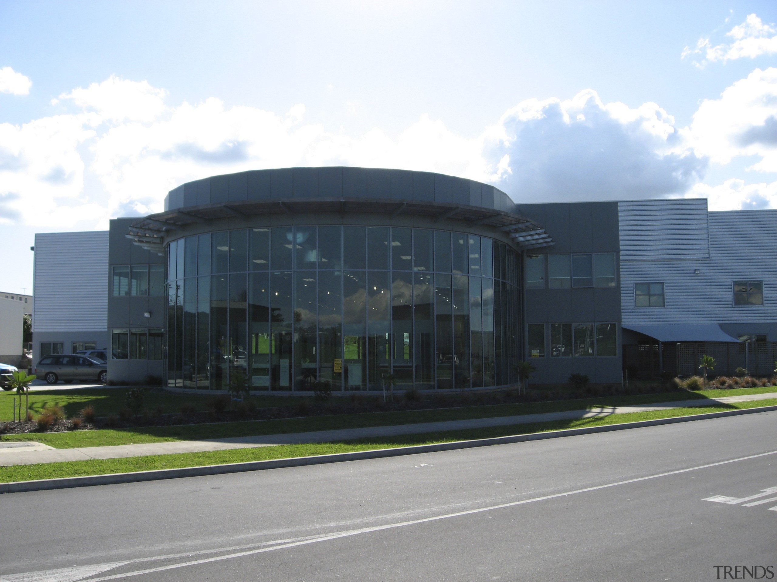 Exterior view of the BCL building in Waitakere architecture, building, commercial building, corporate headquarters, headquarters, real estate, sky, structure, white, black