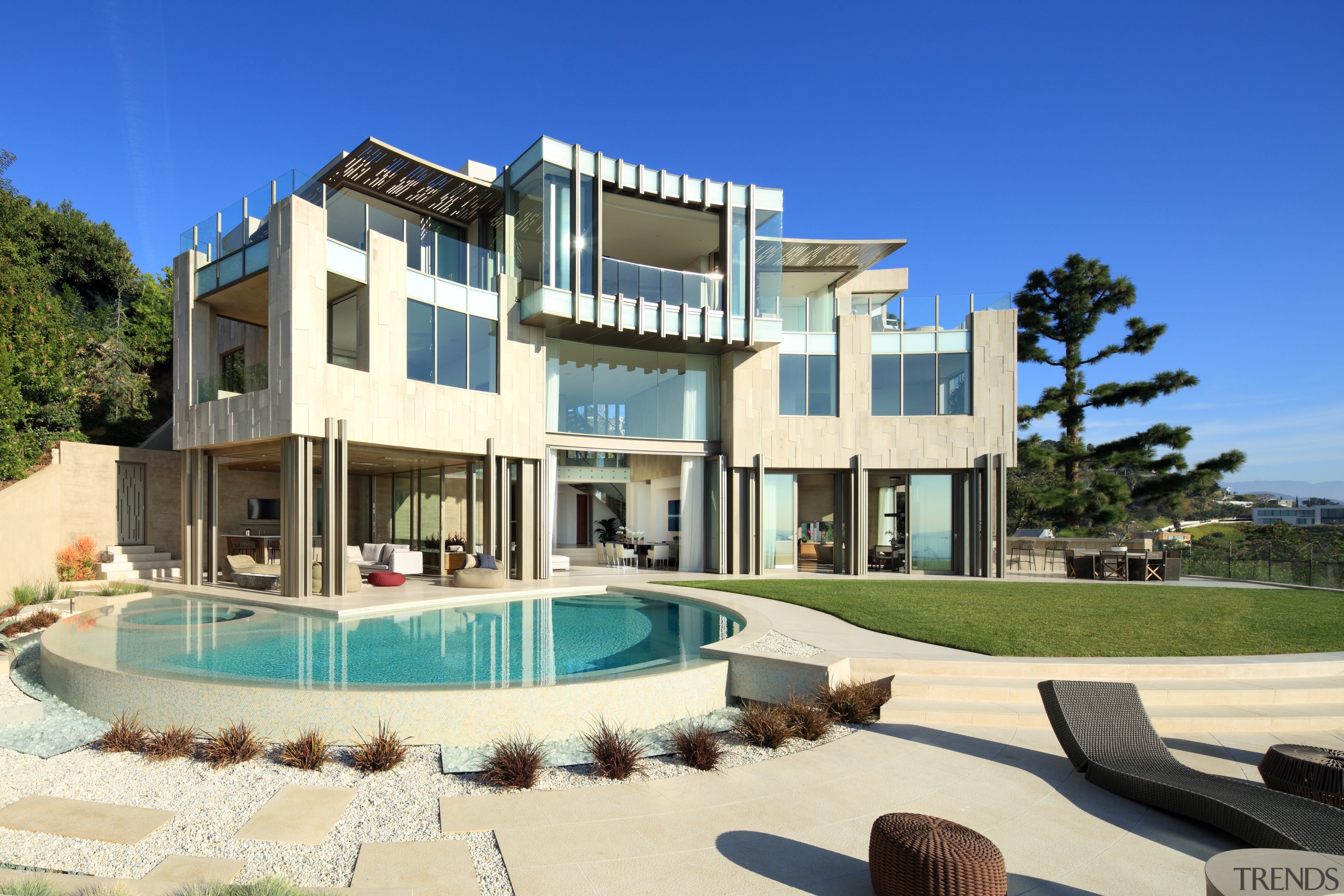 Even the loungers seem to pick up on apartment, building, condominium, elevation, estate, home, house, mansion, property, real estate, residential area, resort, swimming pool, villa, blue, yellow