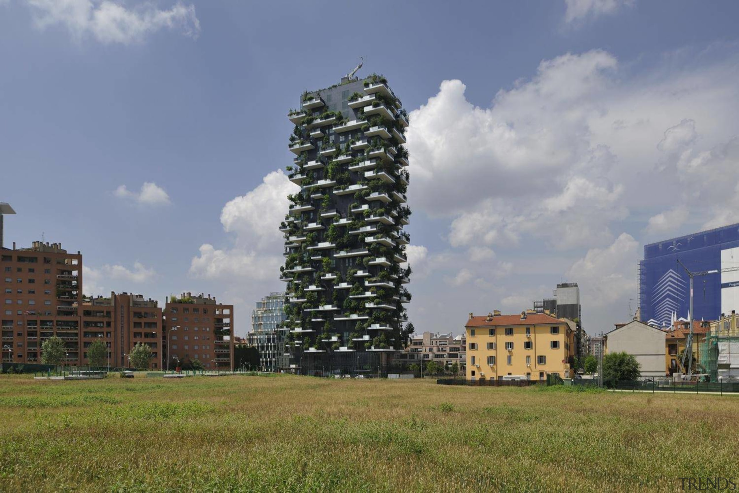 This is definitely a new approach on the building, cloud, condominium, grass, residential area, sky, tower, tower block, tree, gray, brown