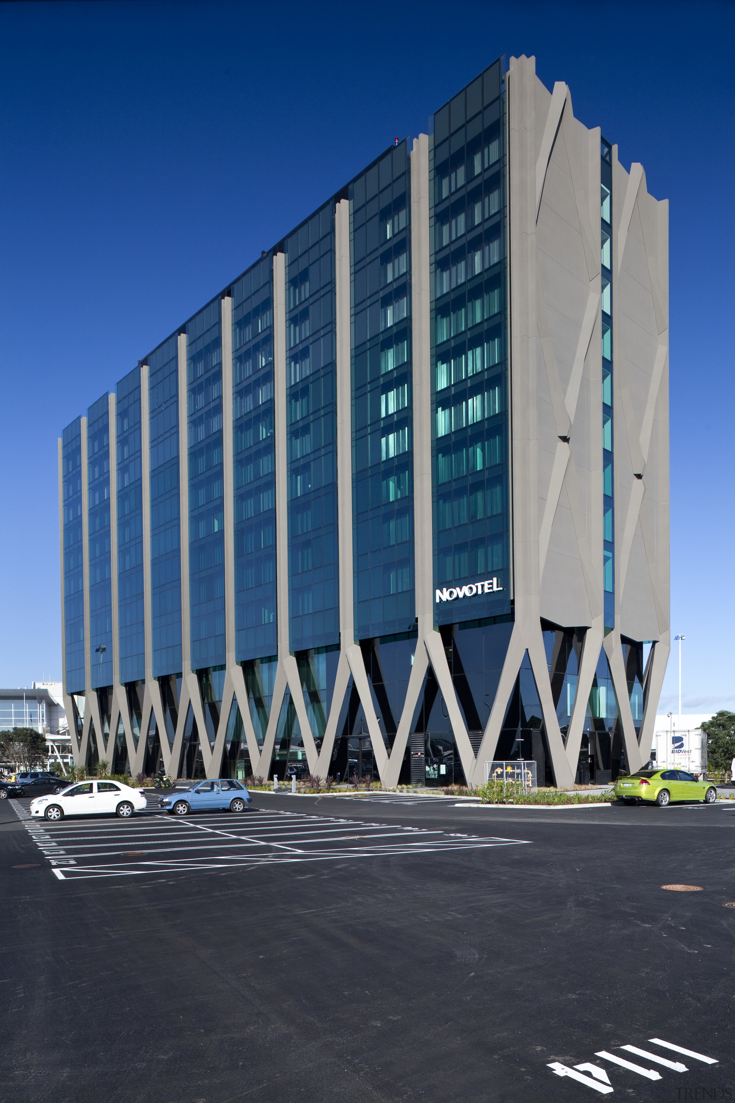 View of the external of the Novotel Auckland architecture, building, commercial building, condominium, corporate headquarters, daytime, facade, headquarters, landmark, metropolitan area, mixed use, sky, structure, tower block, blue, black