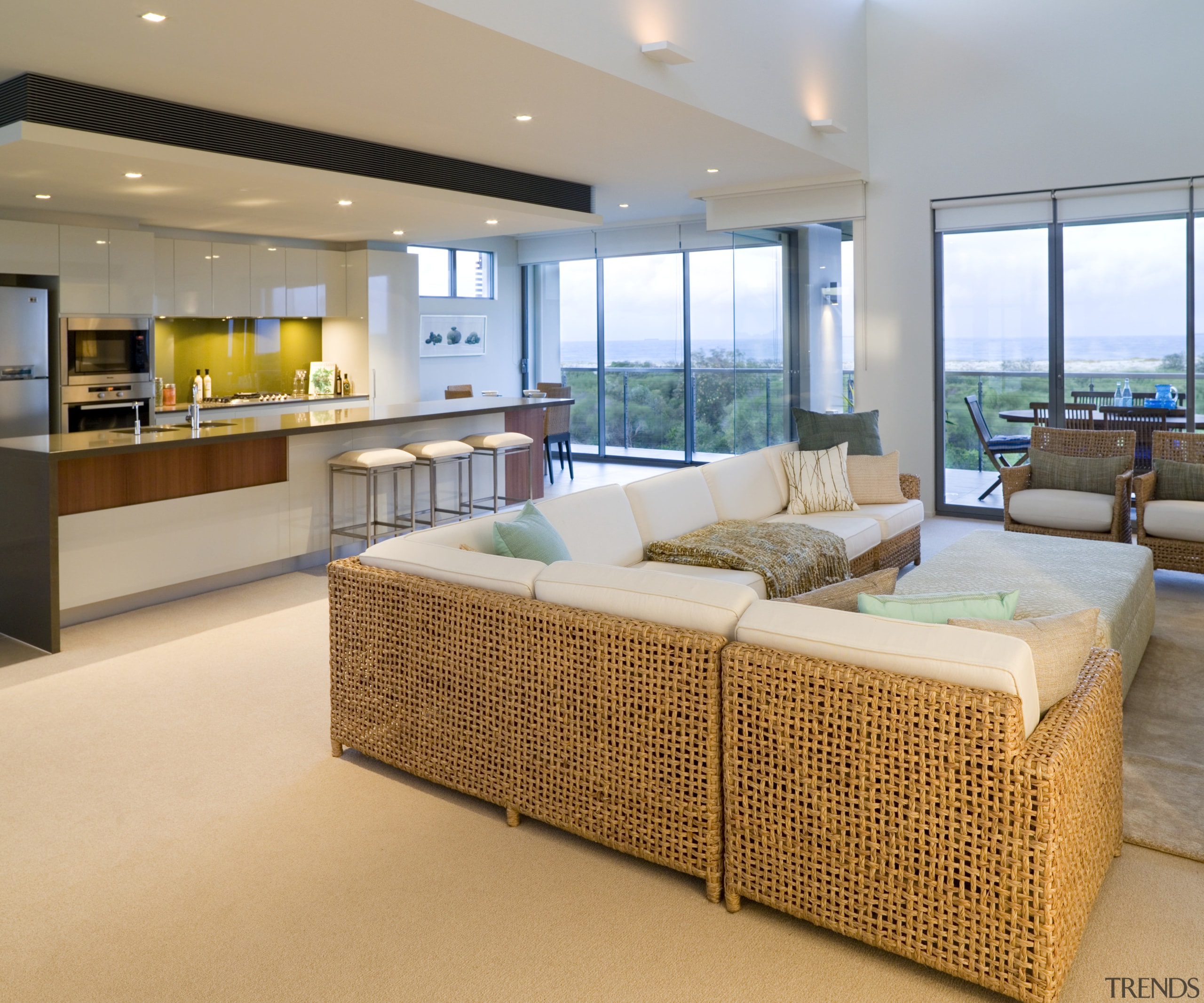 A view of this kitchen featuring Sleek contemporary floor, interior design, living room, real estate, orange, gray