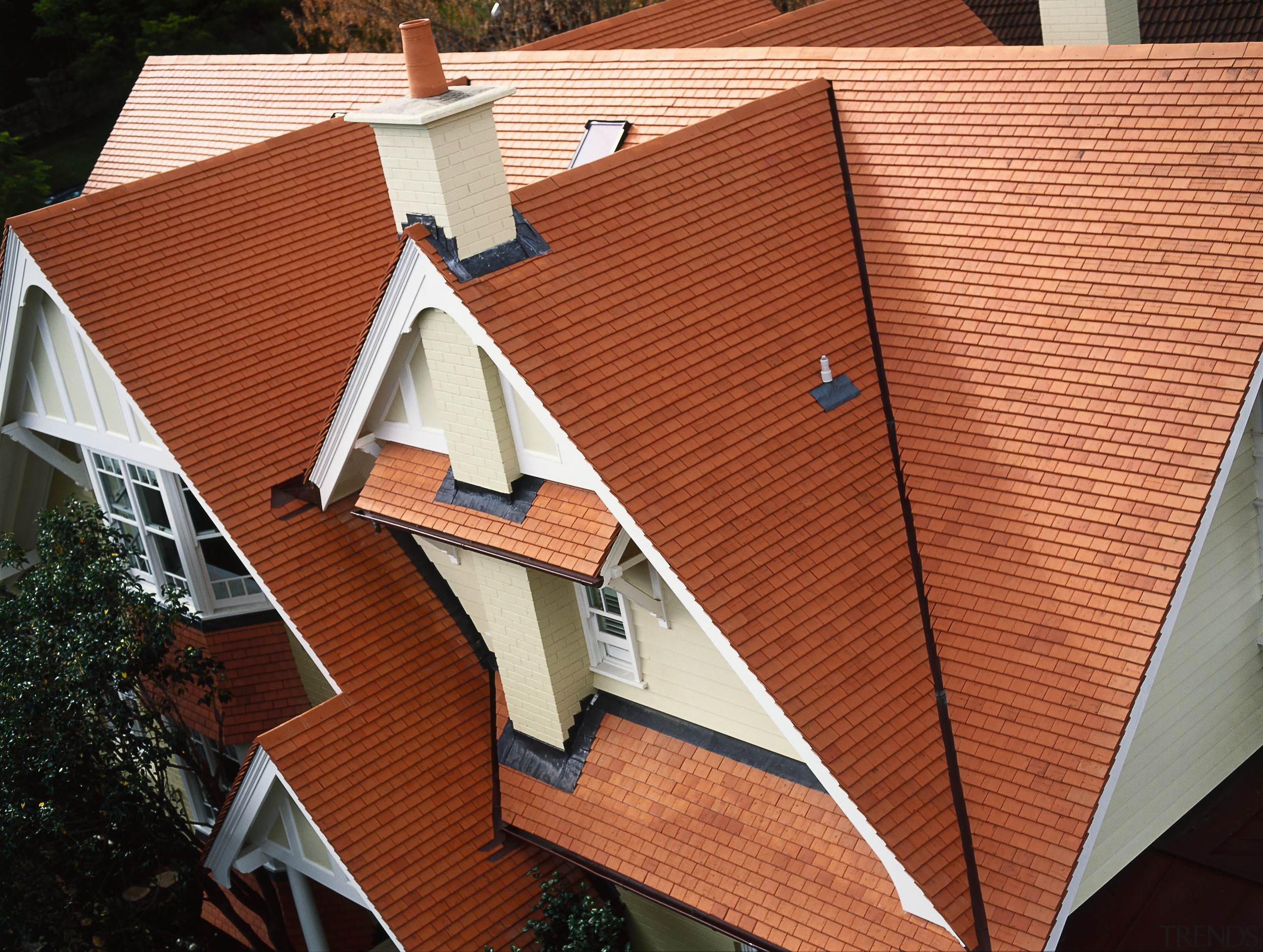 Terracotta coloured shingle roof tiles on steeply pitched architecture, daylighting, facade, house, outdoor structure, roof, window, wood, red