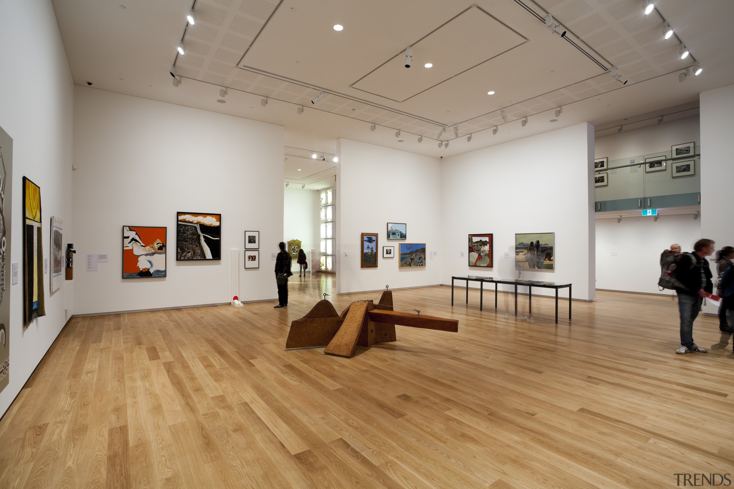 Wallace Construction were contracted to handle the kauri art exhibition, art gallery, exhibition, floor, flooring, museum, tourist attraction, wood, wood flooring, gray, orange
