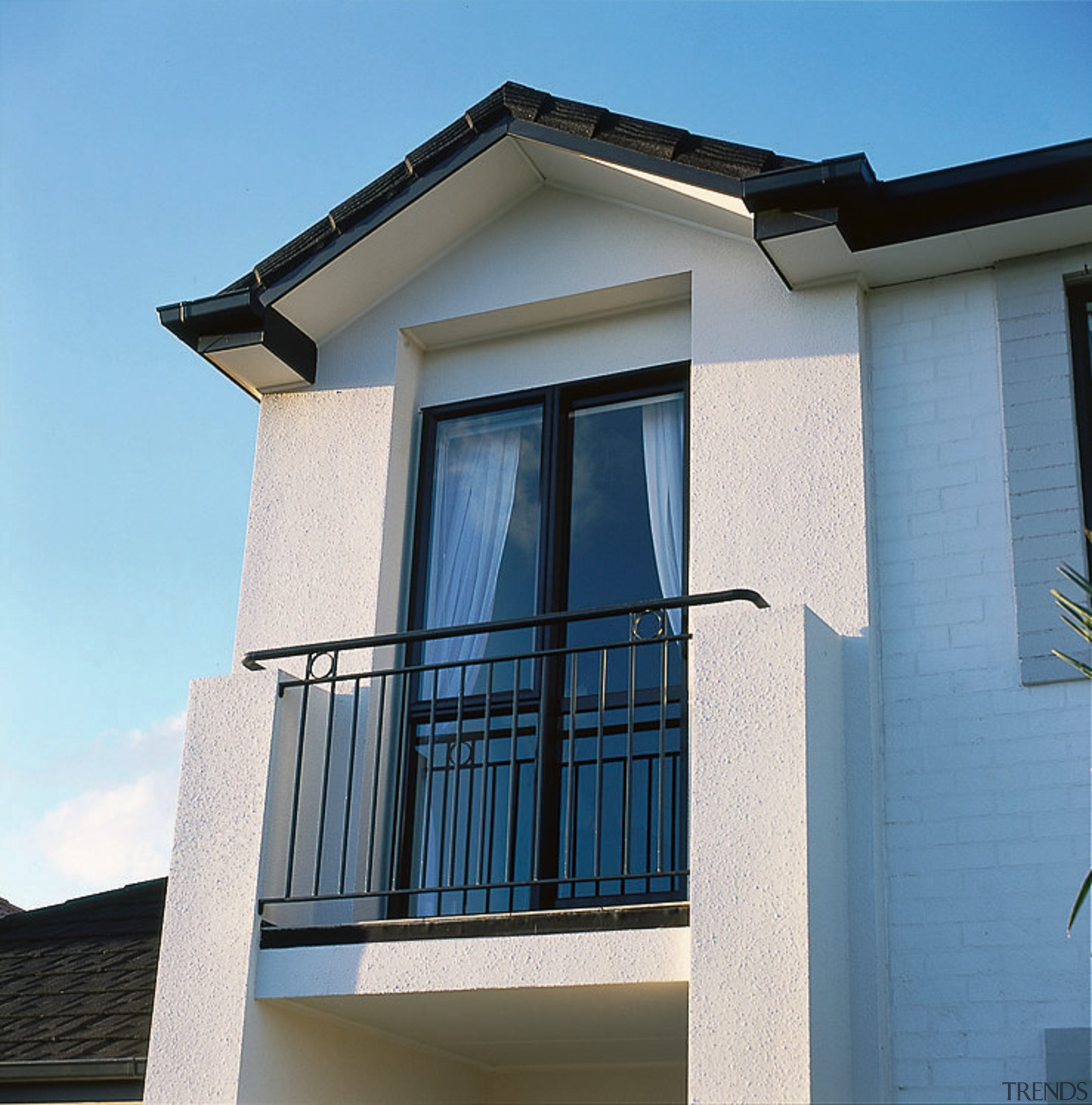 The small balcony of this home - The architecture, balcony, building, facade, home, house, property, real estate, residential area, siding, sky, wall, window, teal