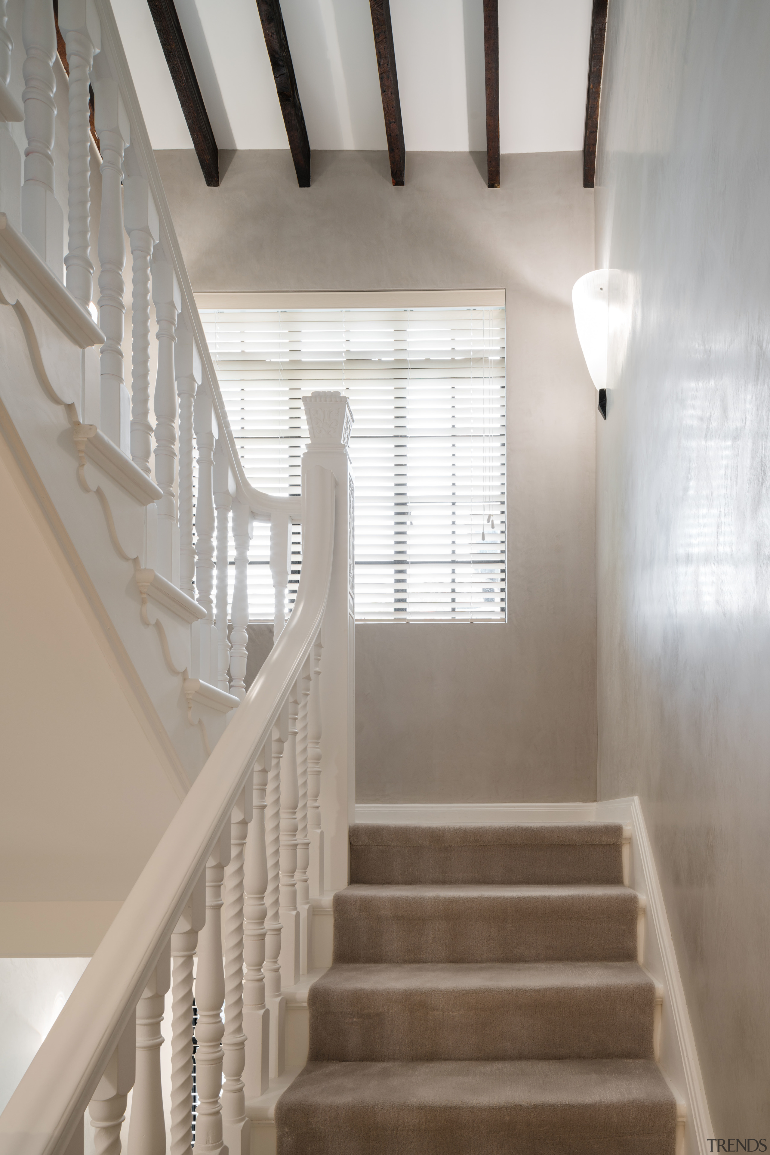 Original detailing was retained in this transformation of architecture, baluster, ceiling, daylighting, estate, floor, handrail, home, house, interior design, property, stairs, structure, gray