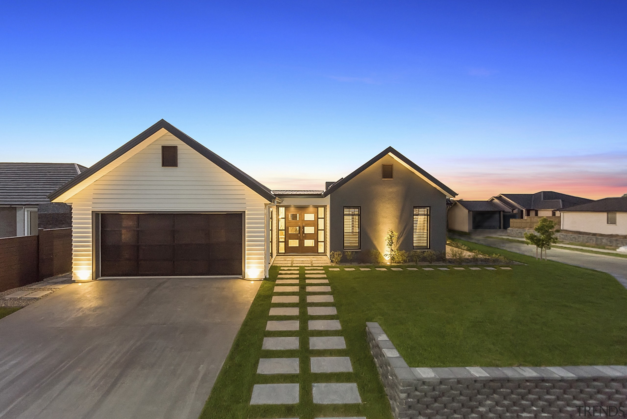 From its elegant front door and double garage building, cottage, elevation, estate, facade, farmhouse, home, house, landscape, lighting, property, real estate, residential area, roof, siding, sky, suburb