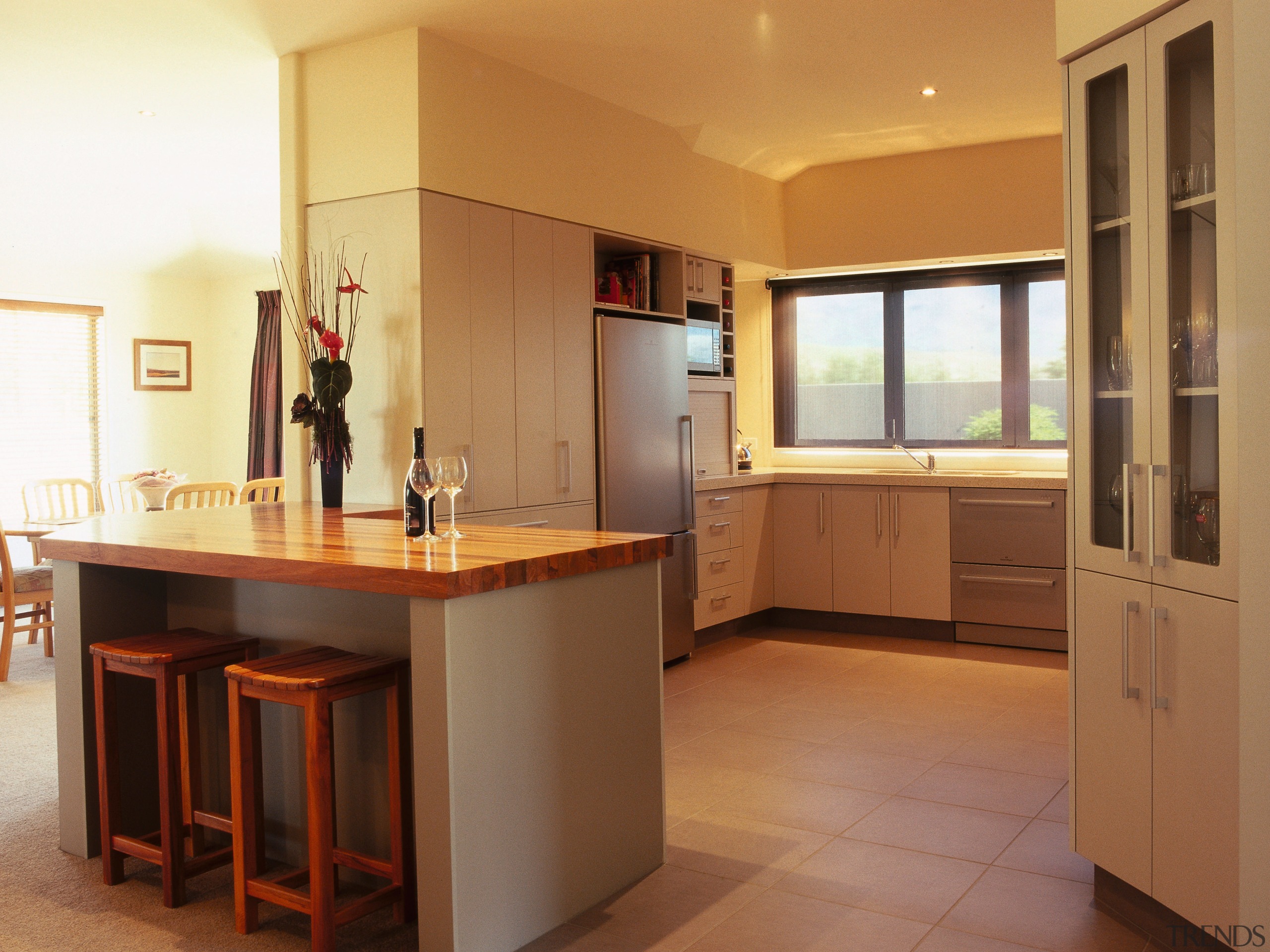 A view of some kitchen cabinetry by the cabinetry, countertop, cuisine classique, floor, flooring, interior design, kitchen, property, real estate, room, brown, orange