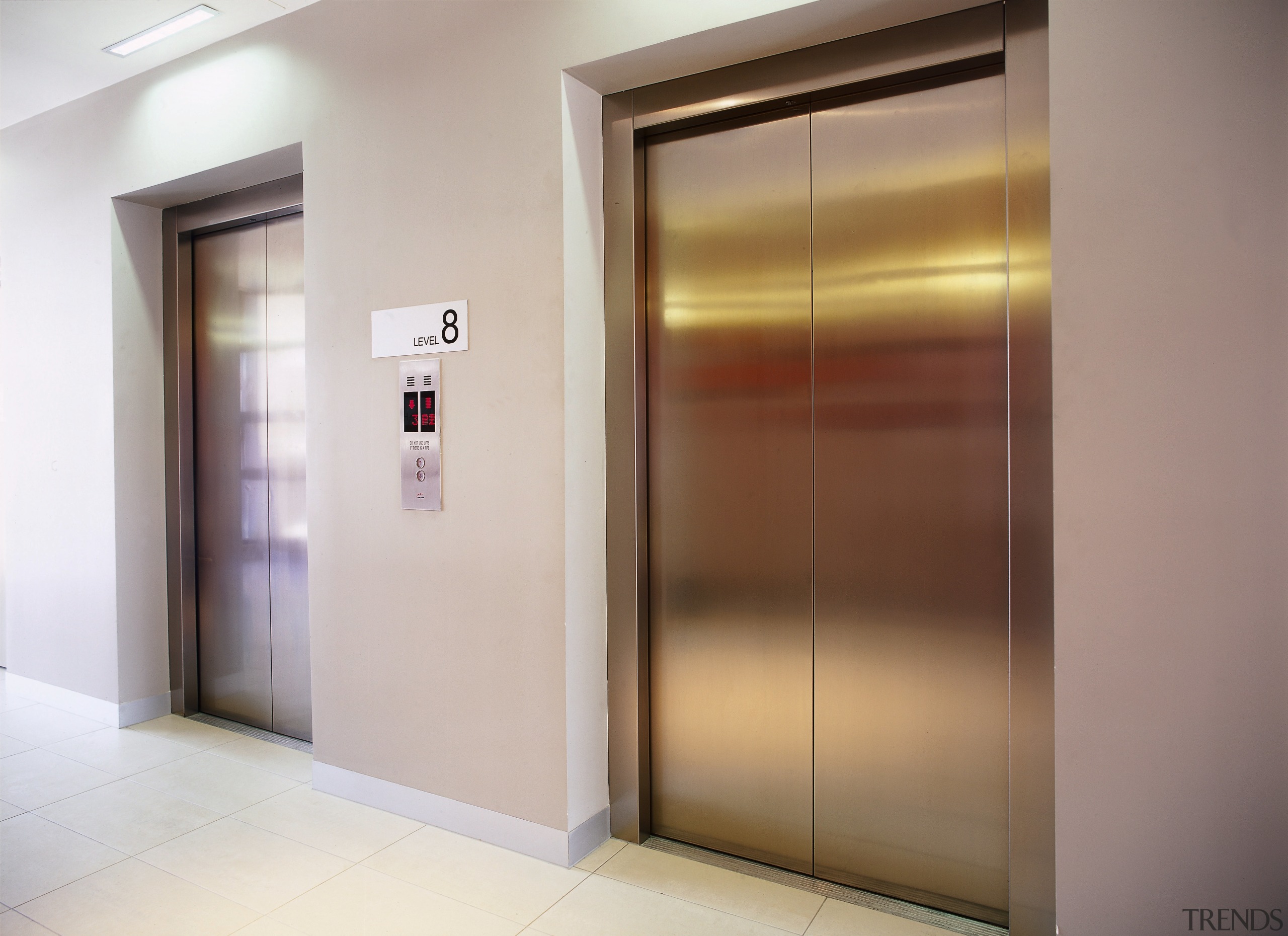 view of the large elevator form eastern elevators door, elevator, interior design, property, gray, brown