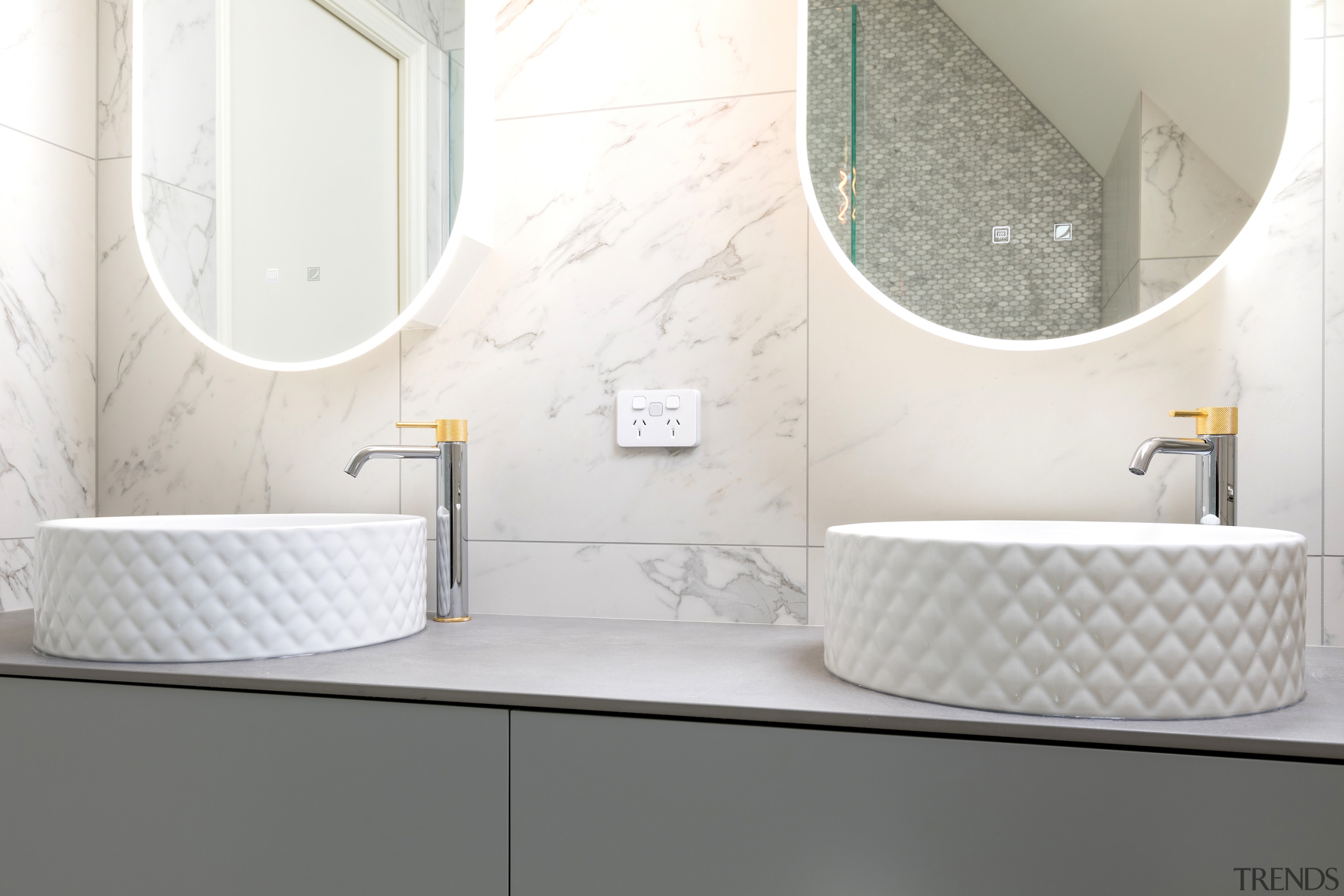 The double custom made vanity has textured Villeroy 