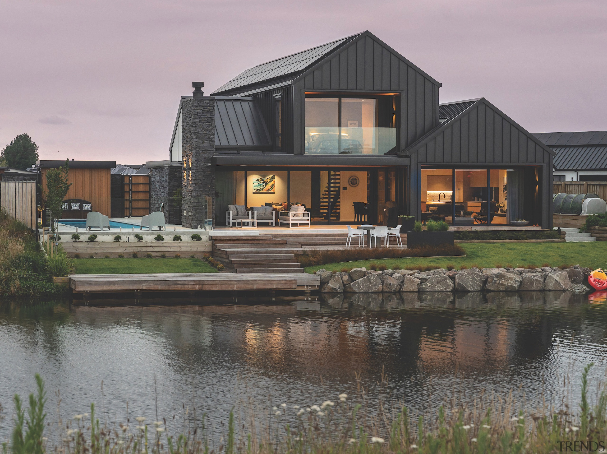 The home is intimately connected to Lake Hood. 