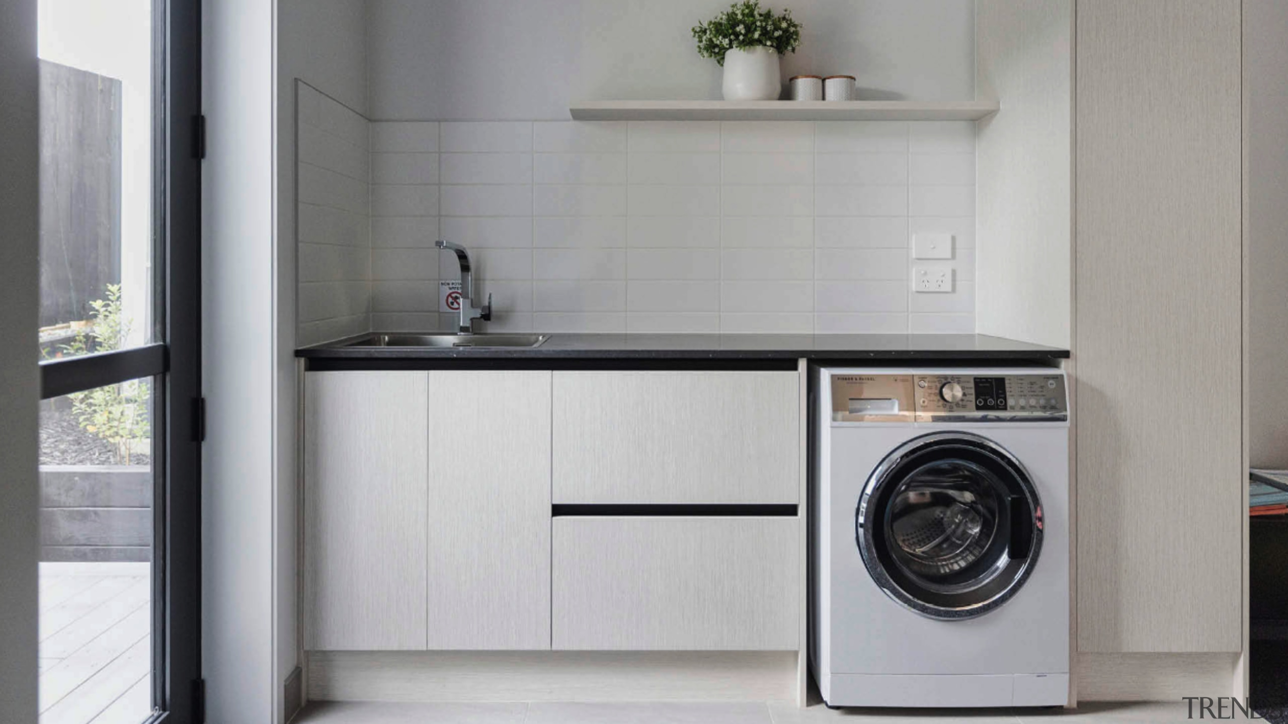 Dedicated laundry space with direct outdoor access. 