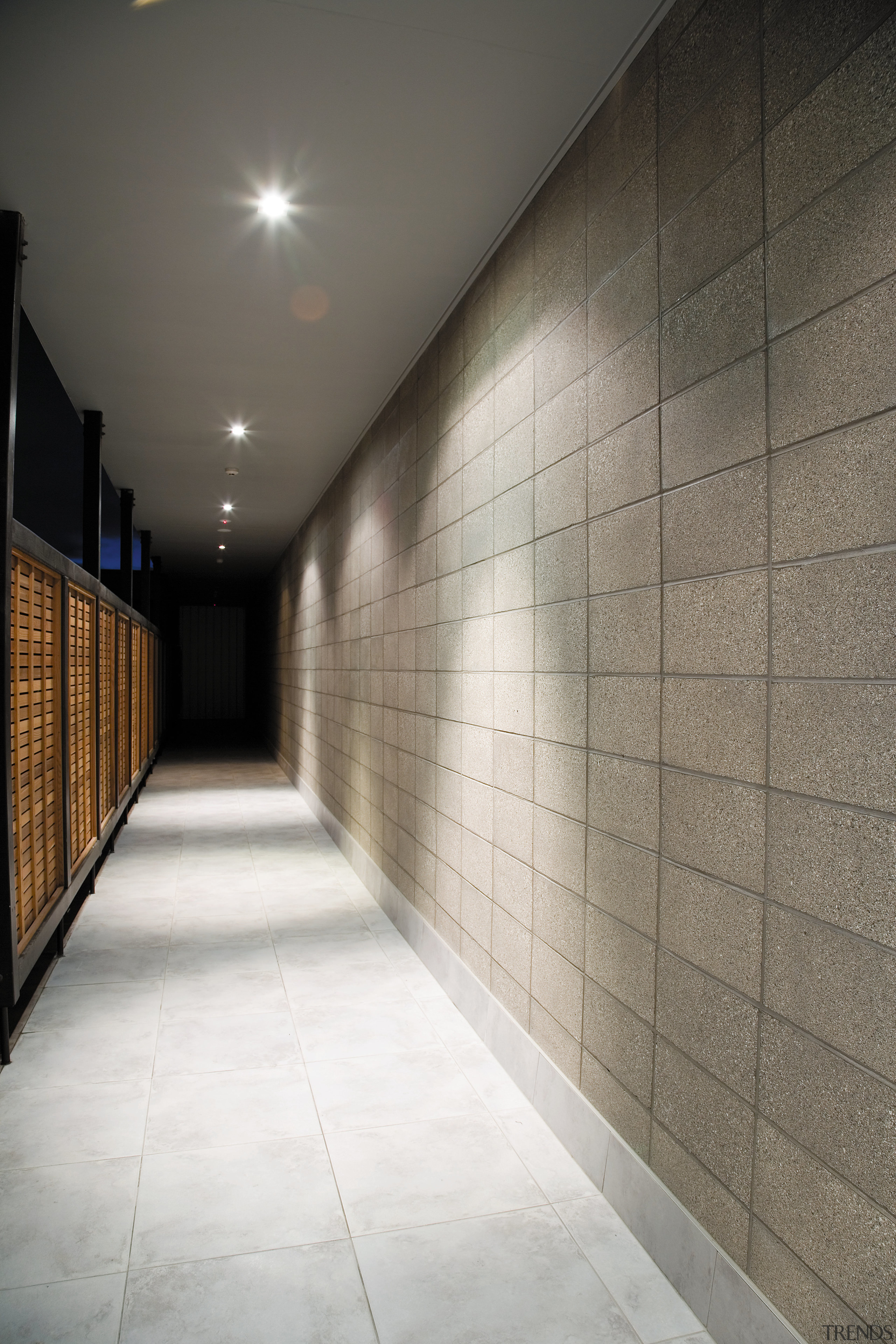 A view of the hallway. - A view architecture, ceiling, daylighting, floor, flooring, interior design, light, lighting, lobby, tile, wall, wood, gray