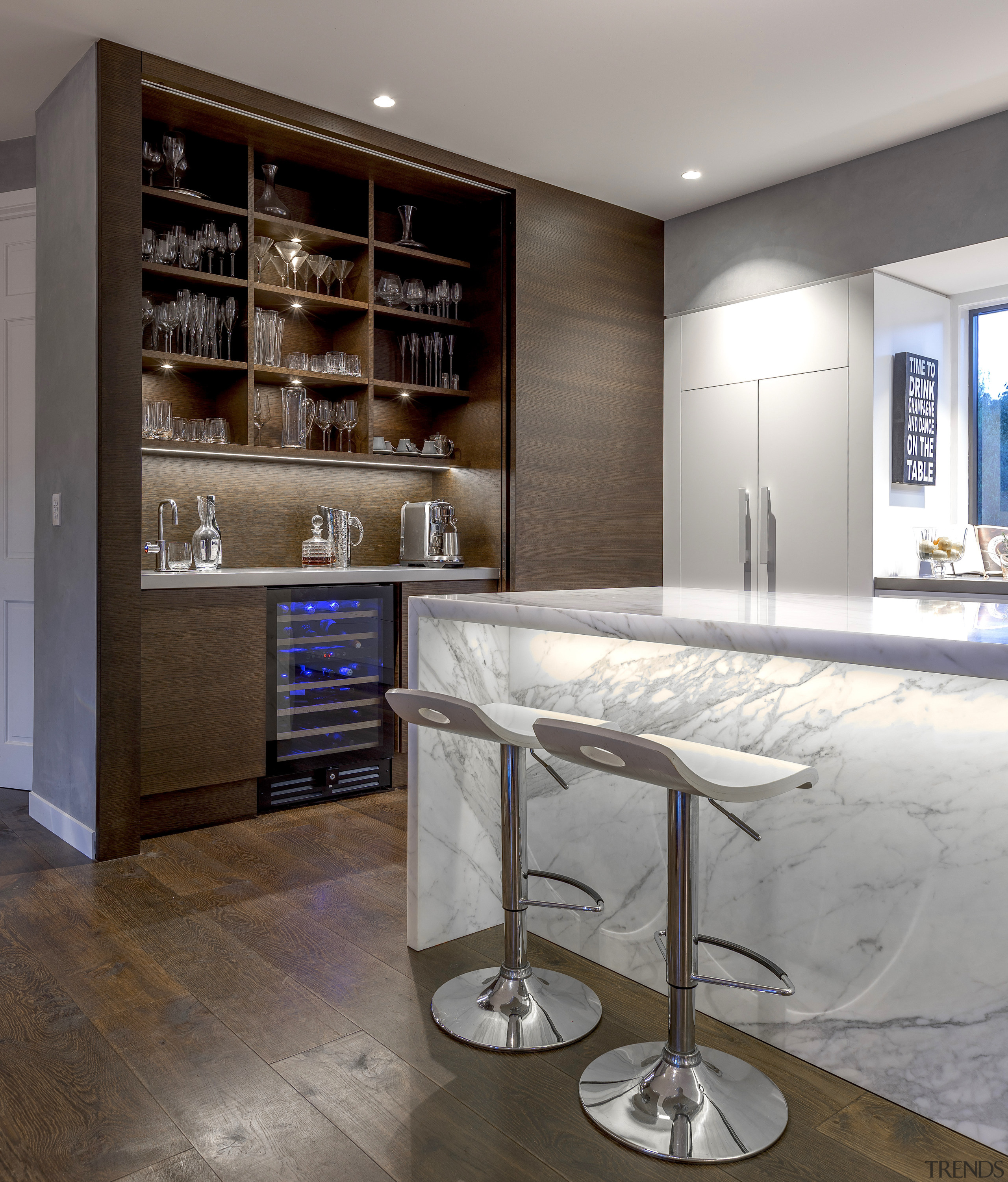 The beautiful appeal of marble and wood come architecture, bar stool, building, cabinetry, ceiling, countertop, floor, flooring, furniture, glass, home, house, interior design, kitchen, lighting, material property, property, real estate, room, shelf, table, gray