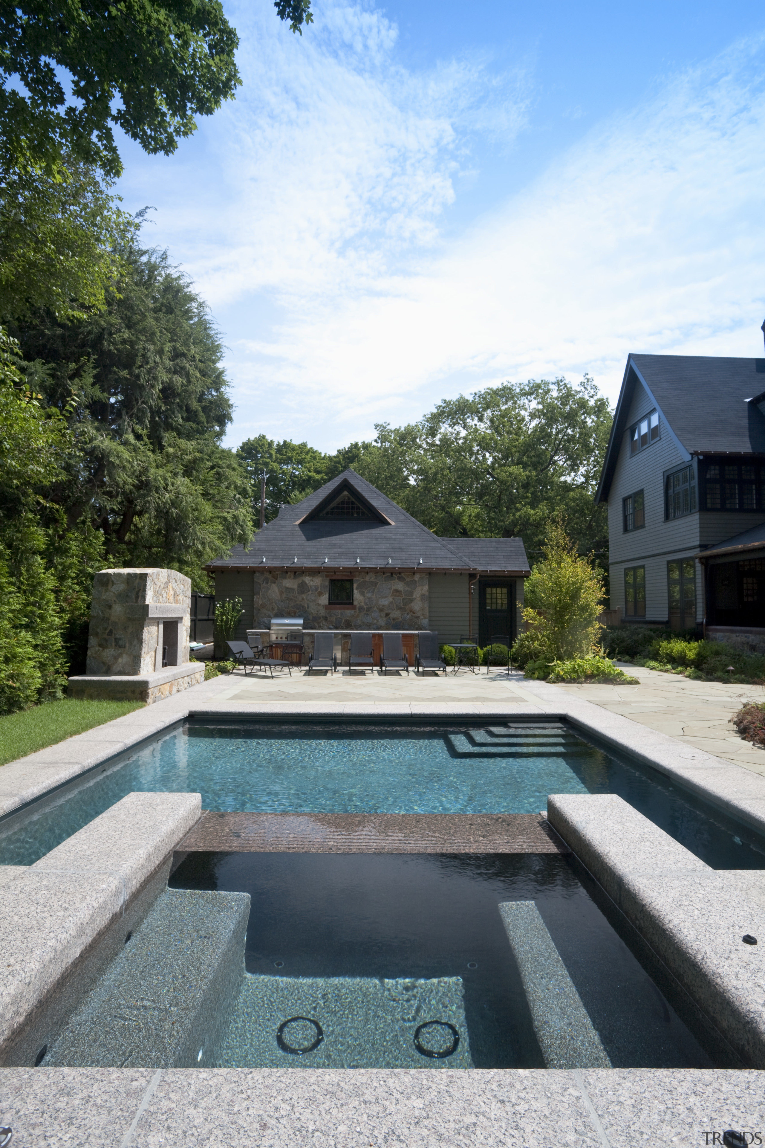 View of outdoor pool area with water feature architecture, estate, home, house, property, real estate, reflection, sky, swimming pool, tree, villa, water, white