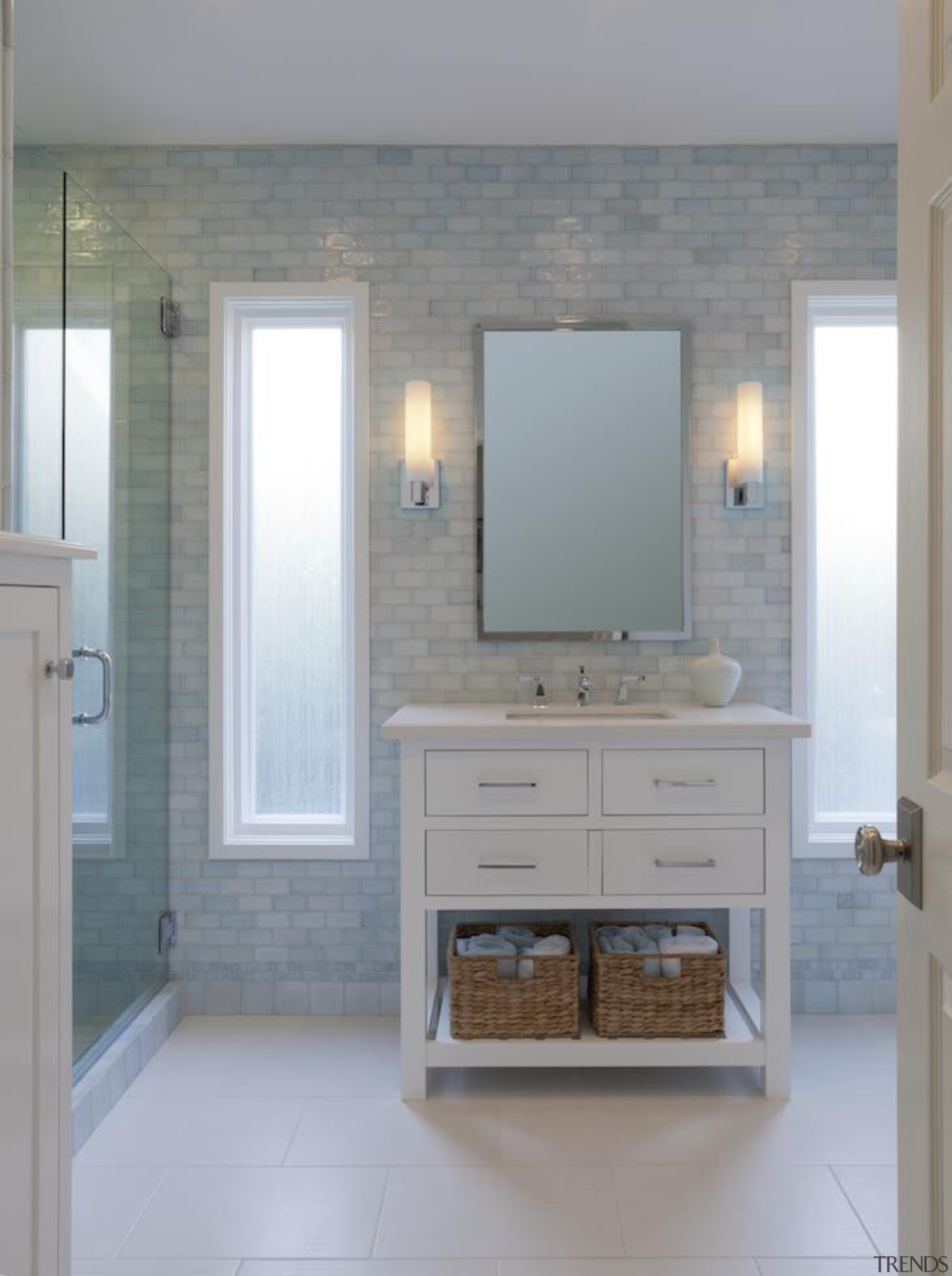 This bathroom evokes a spa like serene feel. bathroom, bathroom accessory, bathroom cabinet, cabinetry, floor, flooring, hardwood, home, interior design, room, sink, tile, wall, wood flooring, wood stain, gray