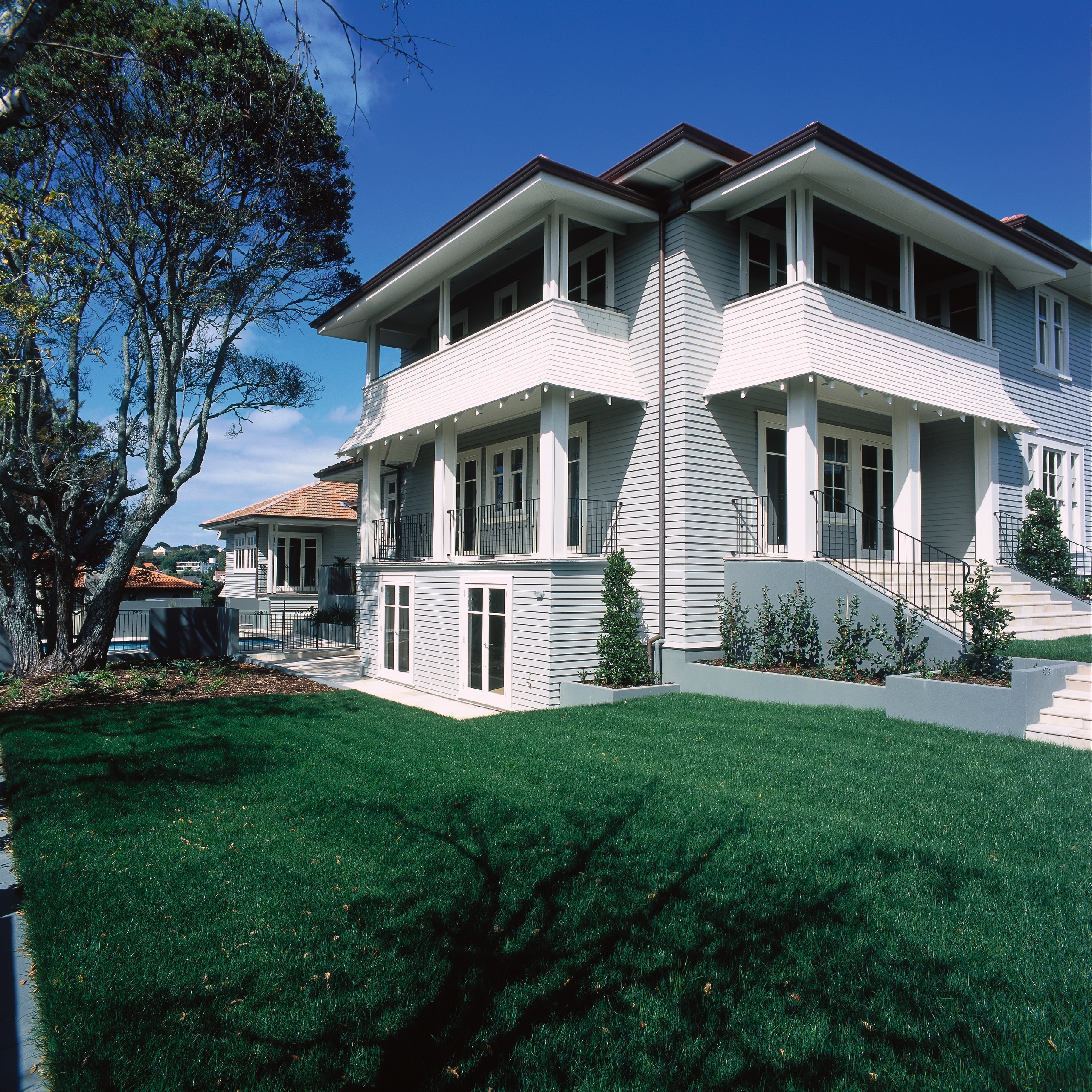 Two storey weatherboard house with large green lawn, cottage, elevation, estate, facade, farmhouse, grass, historic house, home, house, lawn, mansion, neighbourhood, property, real estate, residential area, siding, suburb, villa, window, yard