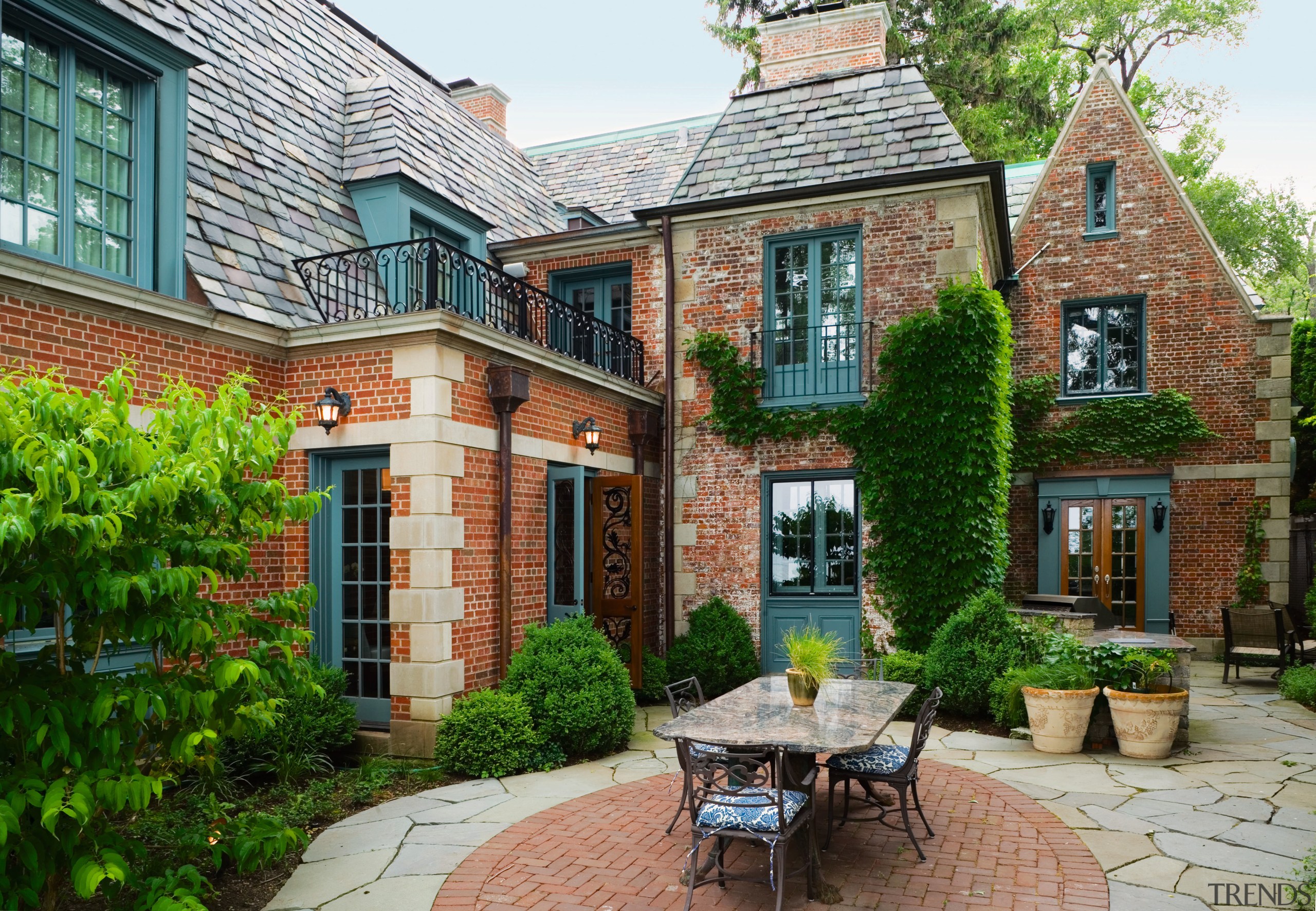 An exterior view of the patio area. - cottage, courtyard, estate, facade, home, house, mansion, neighbourhood, property, real estate, residential area, window