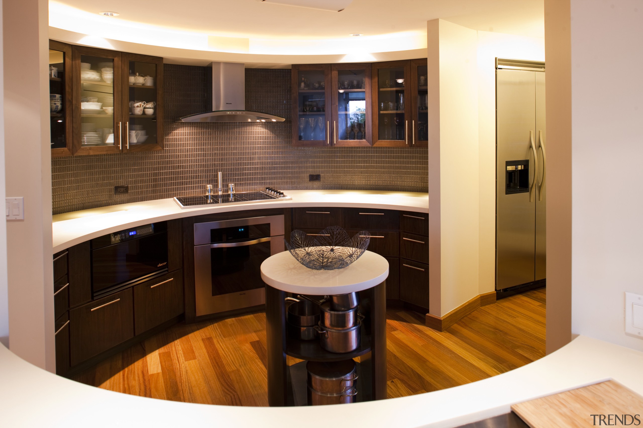 This kitchen with an Asian influence has an cabinetry, countertop, floor, flooring, interior design, kitchen, room, orange, brown