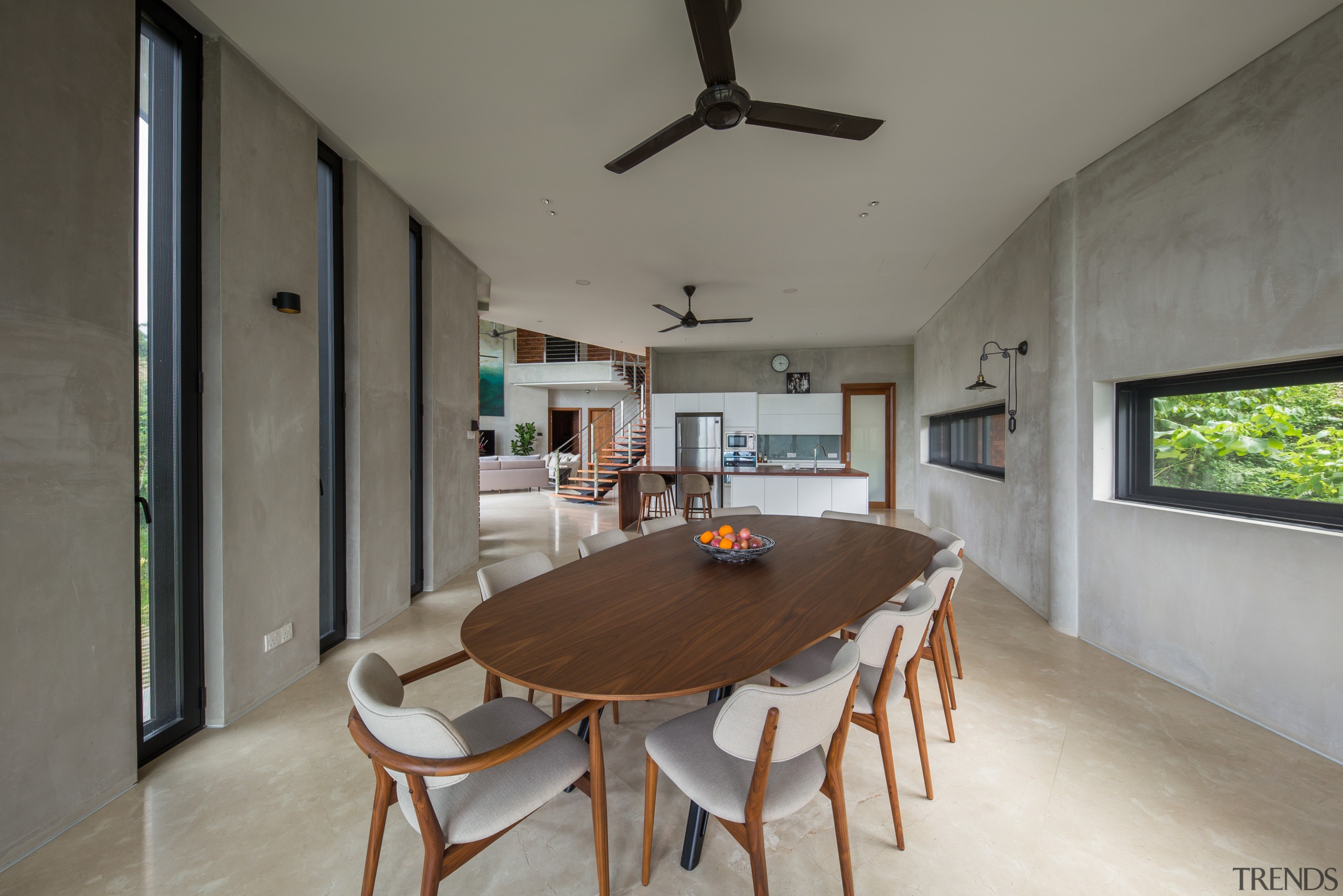 The dining area includes a classic ceiling fan. architecture, building, ceiling, dining room, floor, furniture, home, house, interior design, property, real estate, room, table, gray