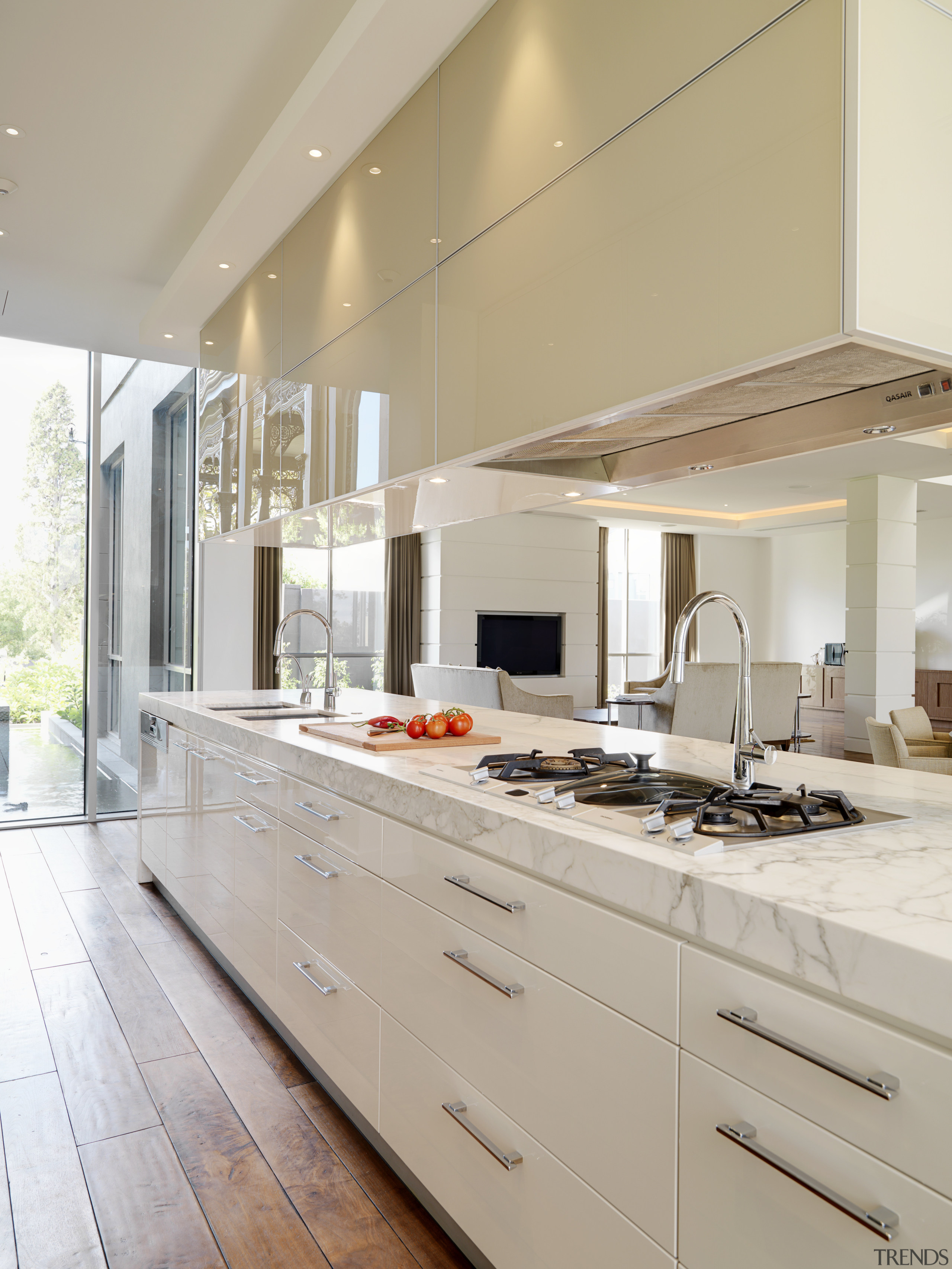 View of large marble island with cooktop, sinks cabinetry, countertop, cuisine classique, interior design, kitchen, real estate, gray