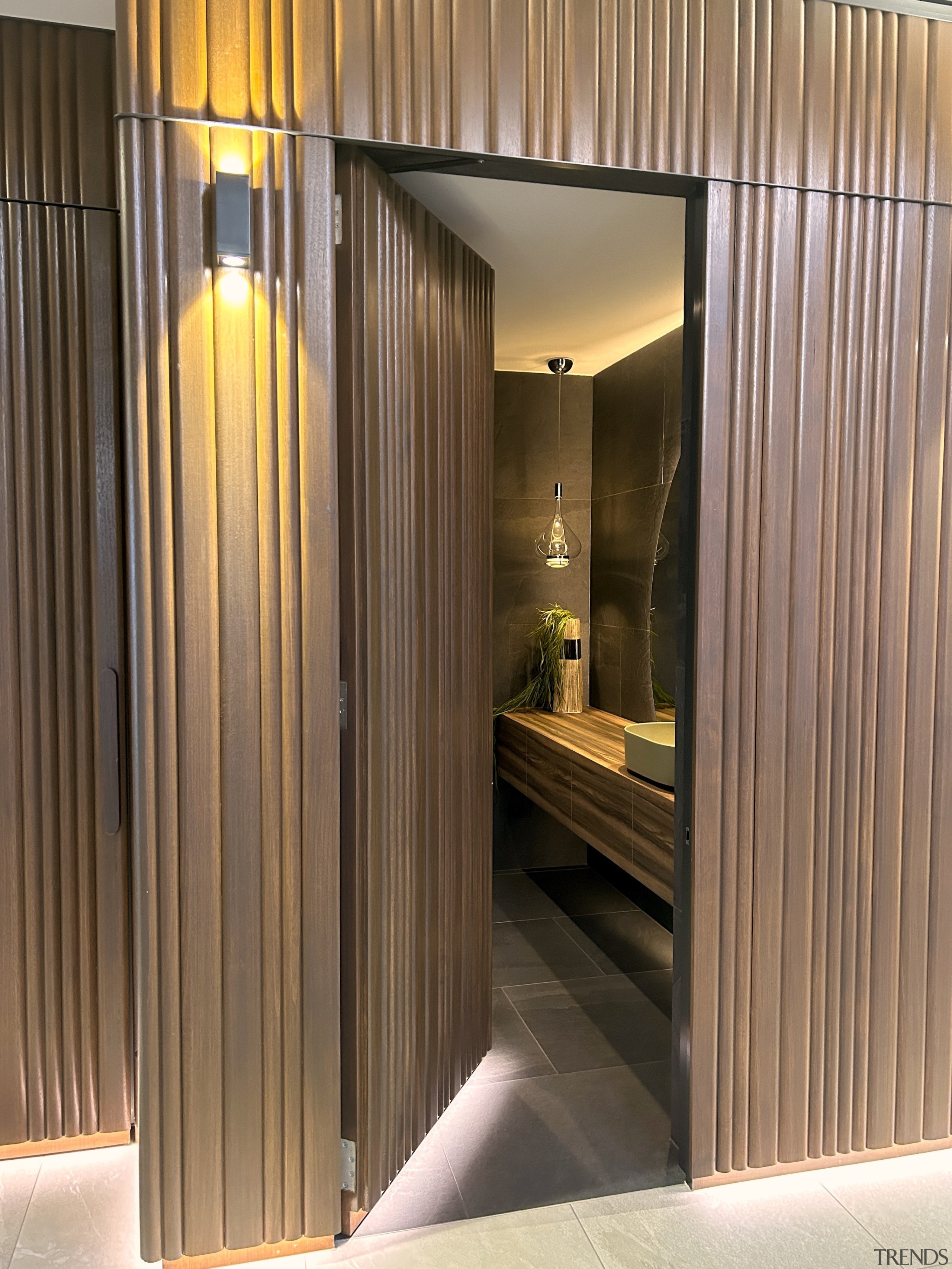 The powder room door is clad in the 