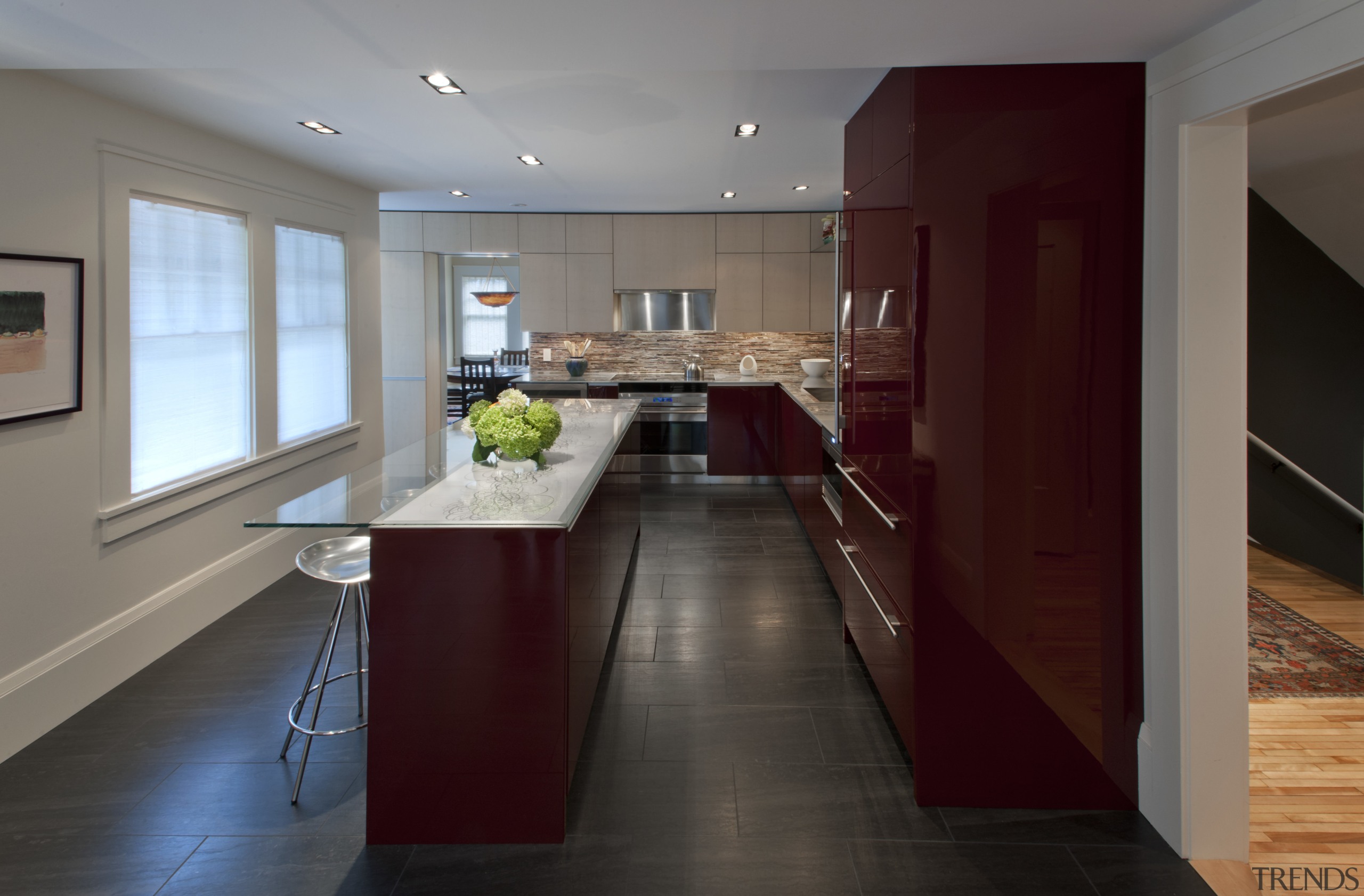 Contemporary kitchen with red cabinetry - Contemporary kitchen architecture, cabinetry, ceiling, countertop, cuisine classique, floor, flooring, hardwood, house, interior design, kitchen, laminate flooring, real estate, room, wood flooring, gray