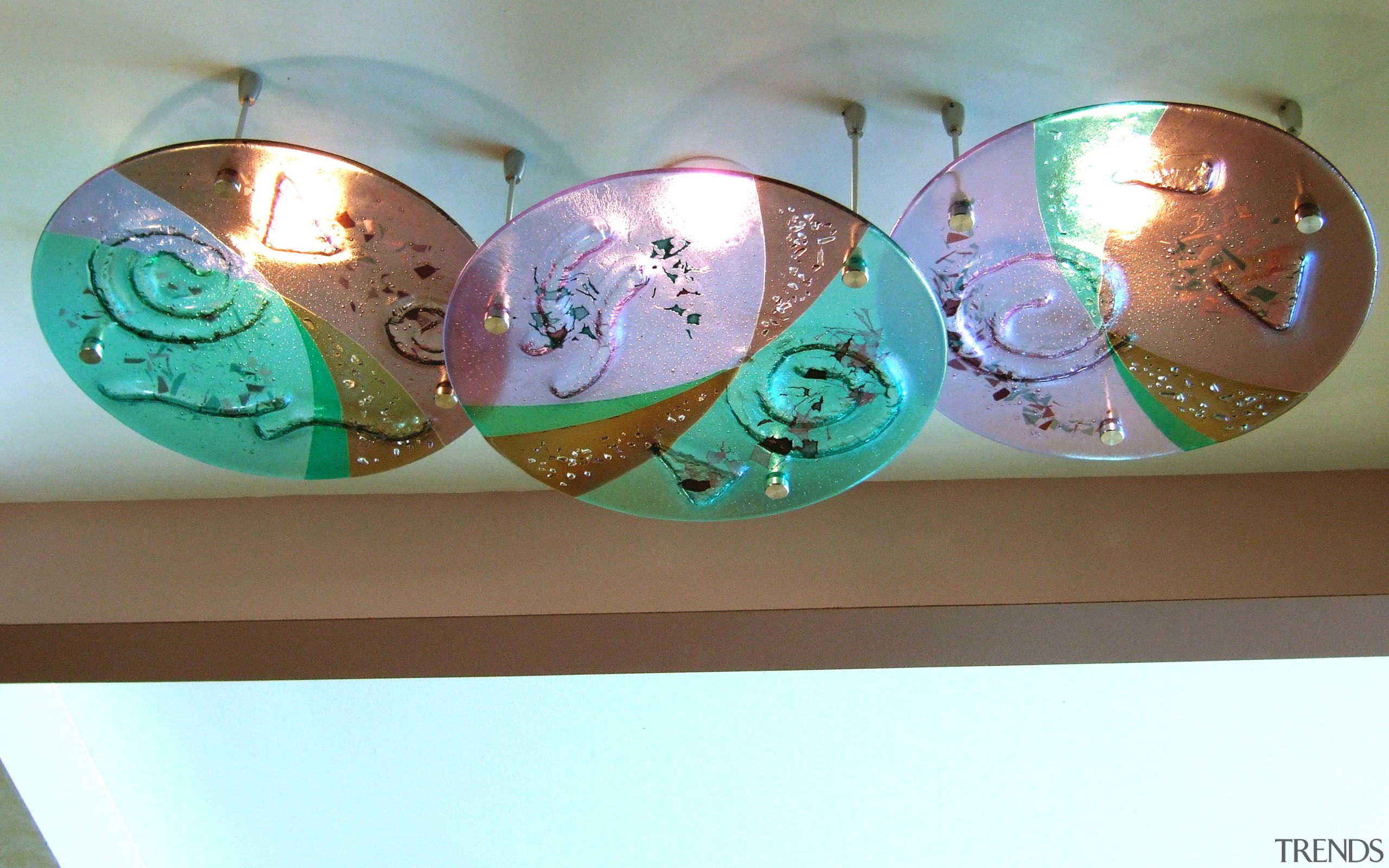 View of three pieces of lighted fused glass lighting accessory, white, brown