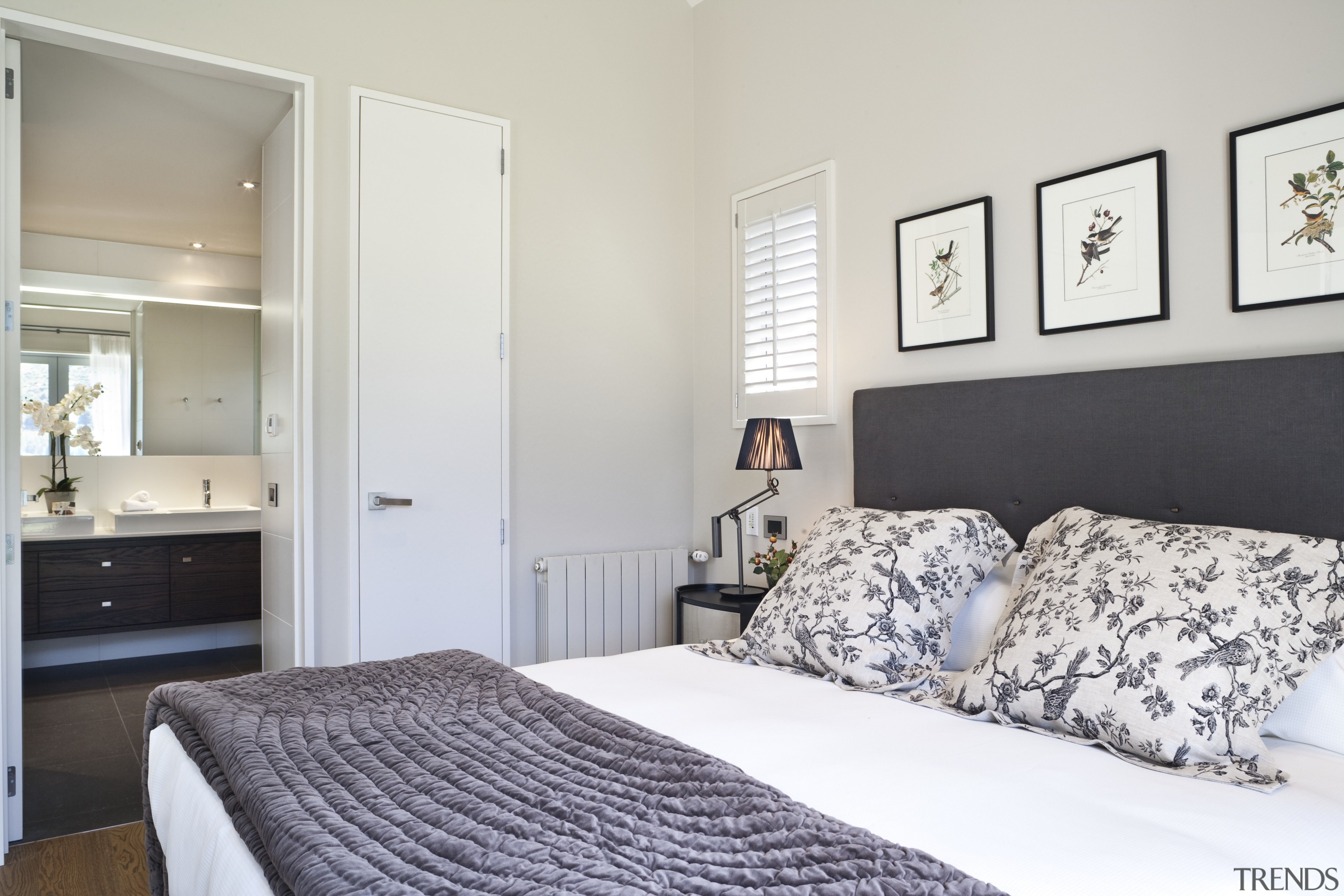 View of bedroom featuring bed with white linen, bed frame, bedroom, home, interior design, real estate, room, suite, wall, window, gray, white