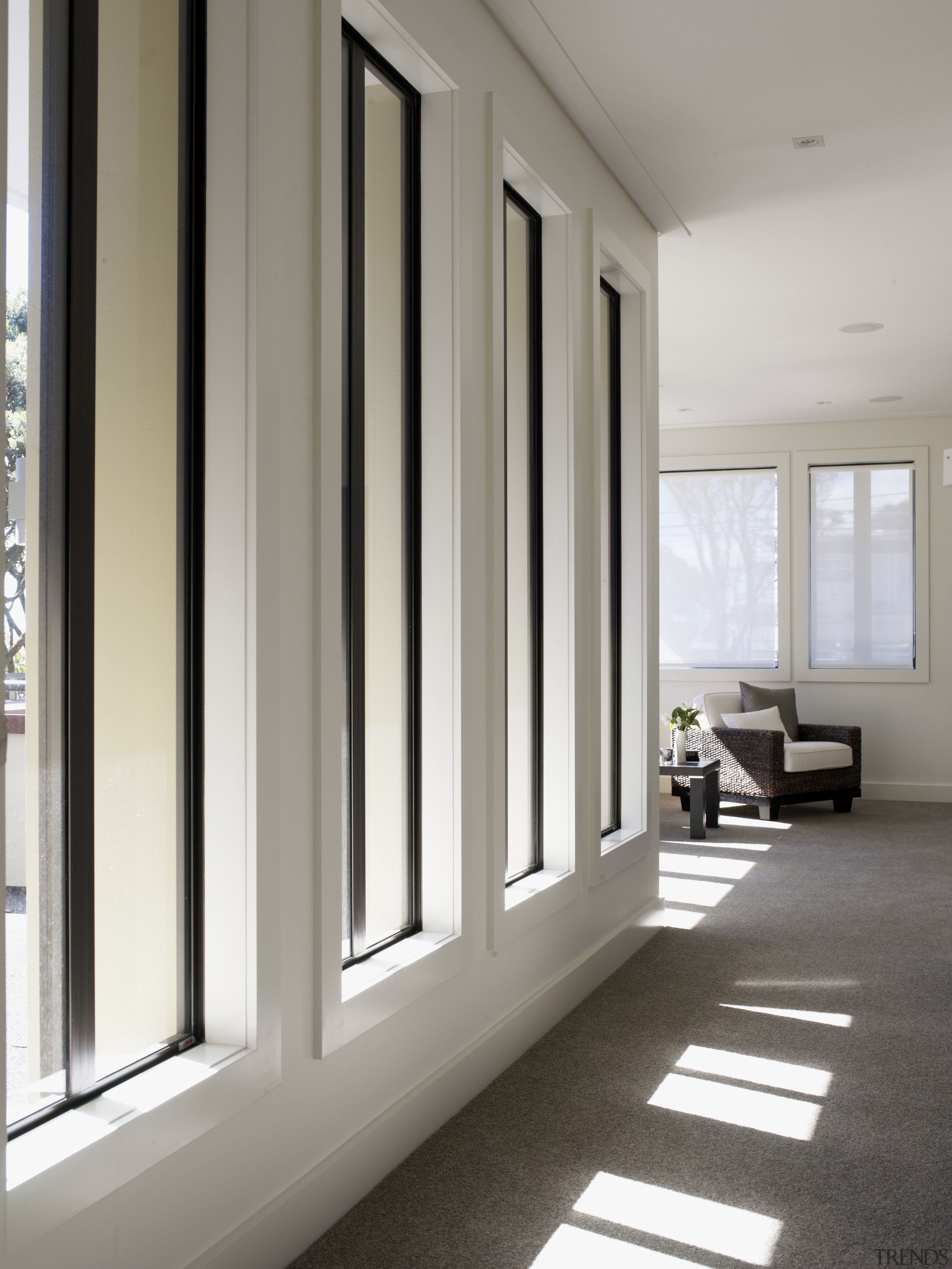 Tall windows overlook the hall to the master door, floor, flooring, home, interior design, real estate, window, window covering, gray, white