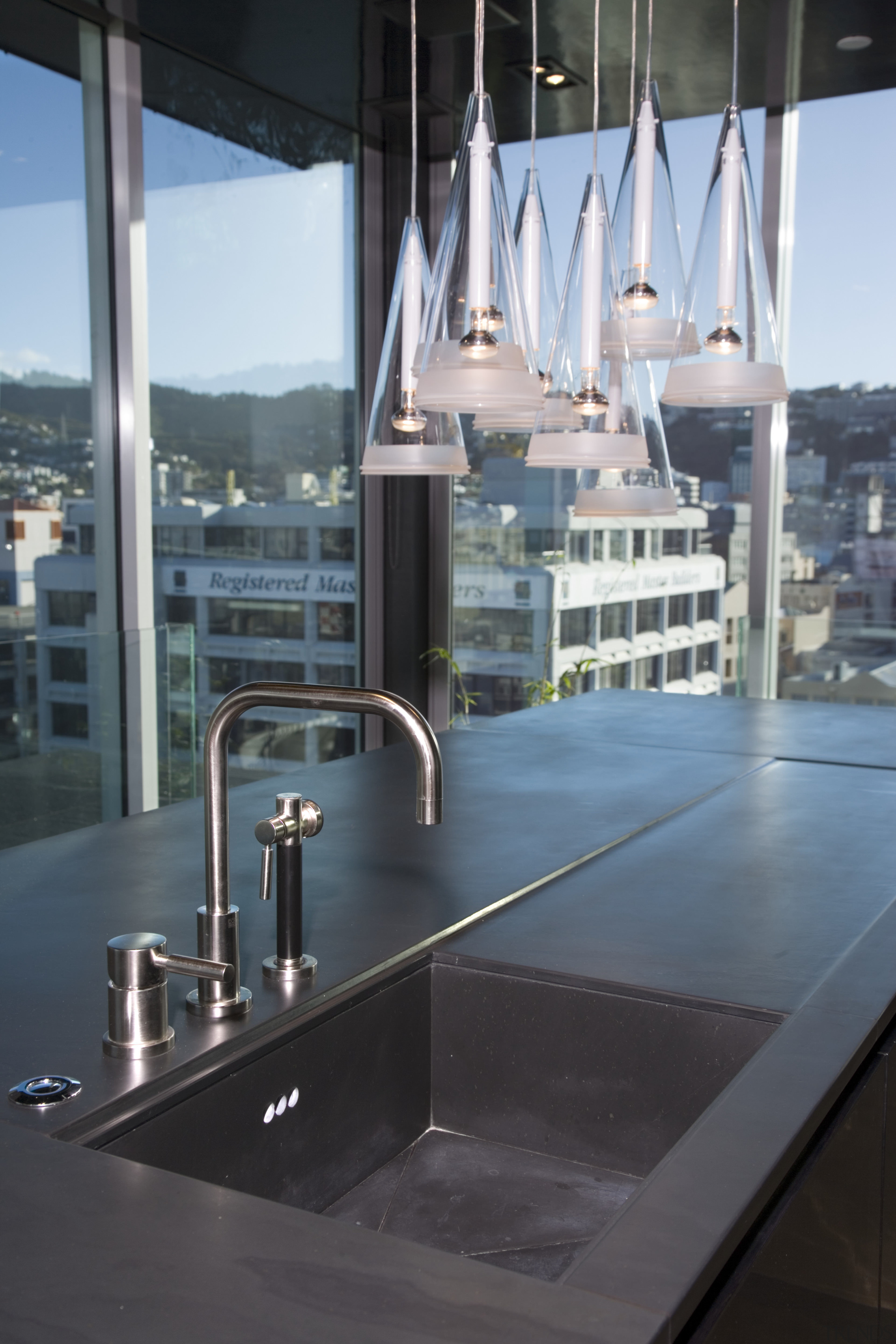 View of kitchen desihned by Architect Angela Foster glass, black