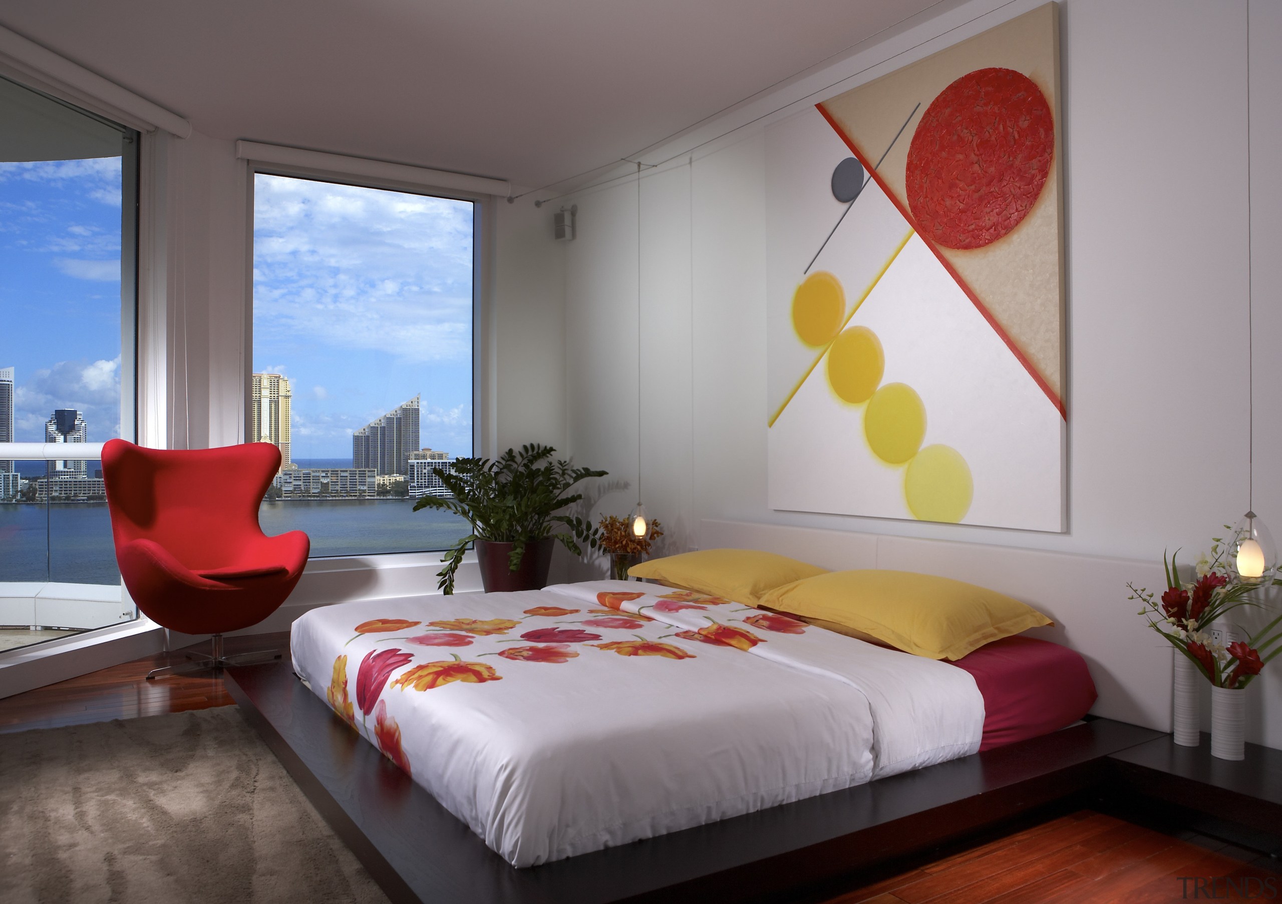 View of bedrrom with yellow and red artwork. bed, bed frame, bed sheet, bedroom, ceiling, home, interior design, real estate, room, suite, wall, window, gray