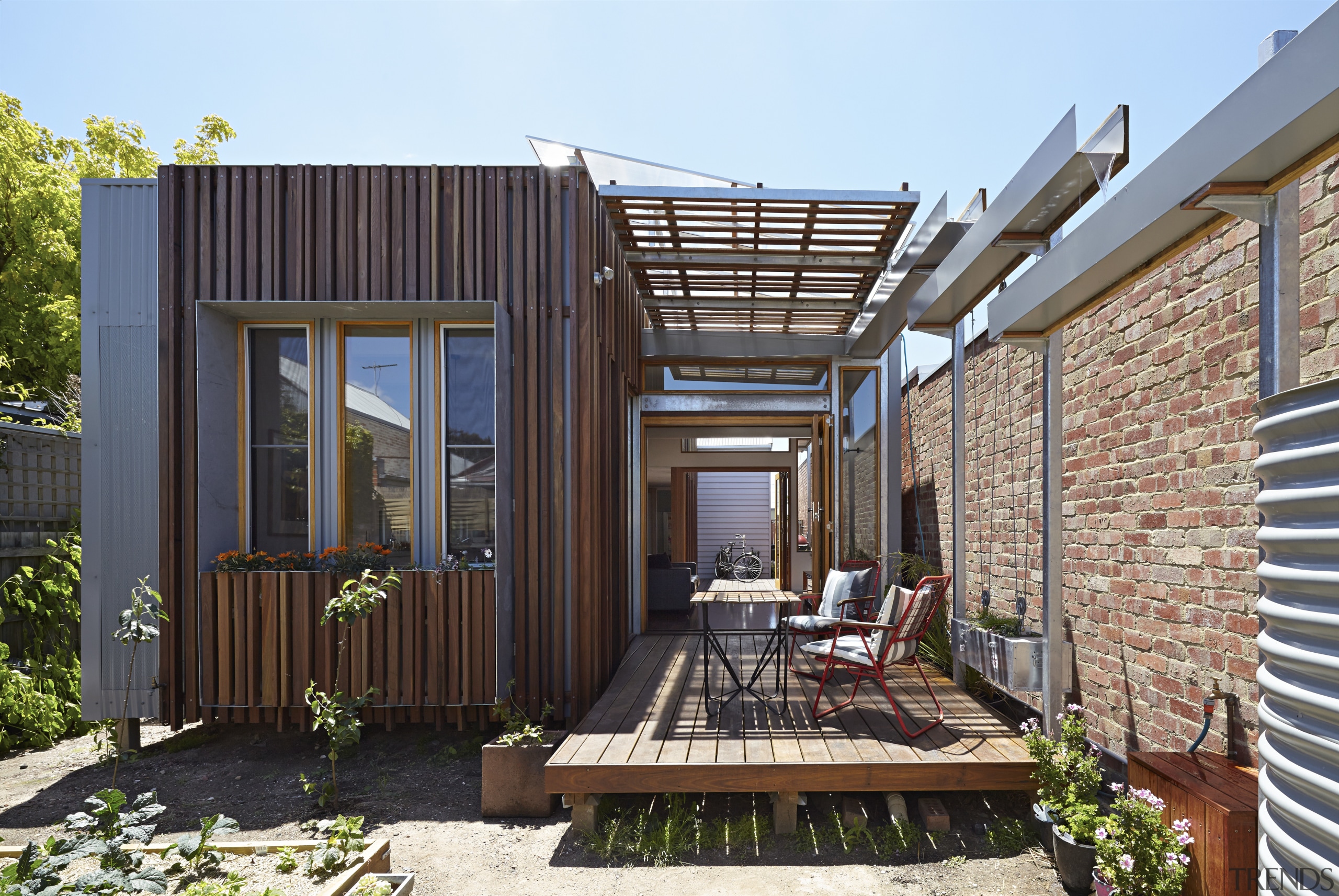 The Convertible Courtyards House by Christopher Megowan Design backyard, deck, facade, home, house, outdoor structure, property, real estate, siding, black