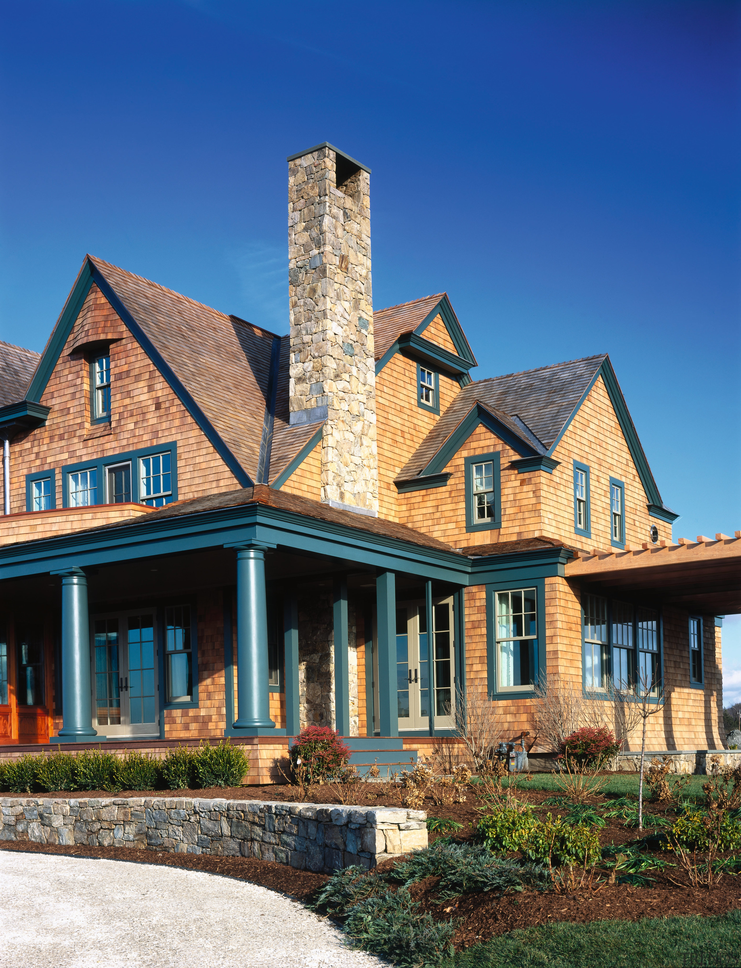 Exterior view of a wooden shingle house, green building, cottage, estate, facade, farmhouse, historic house, home, house, mansion, neighbourhood, property, real estate, residential area, roof, siding, sky, suburb, window, blue