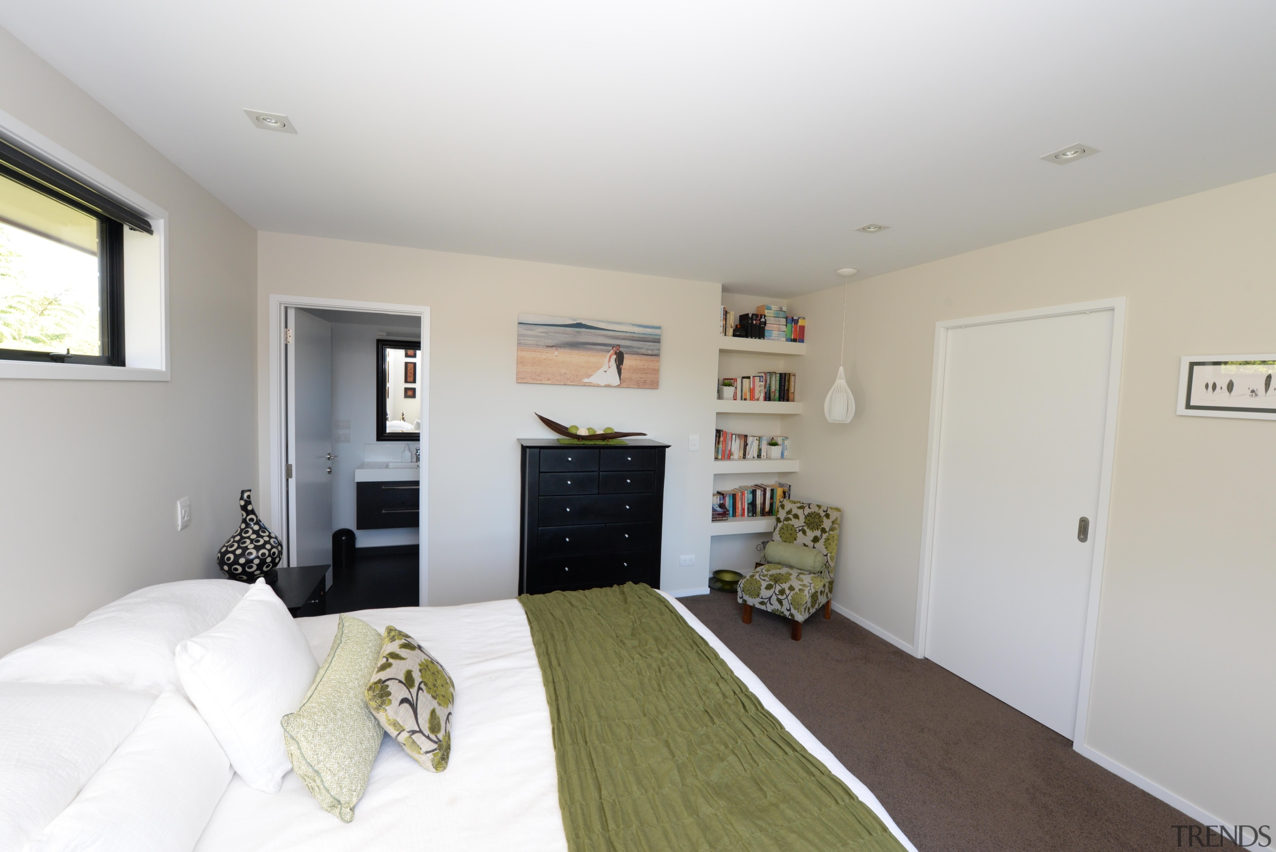 Master bedroom with an ensuite and sitting corner.Built bedroom, floor, home, house, interior design, living room, property, real estate, room, gray