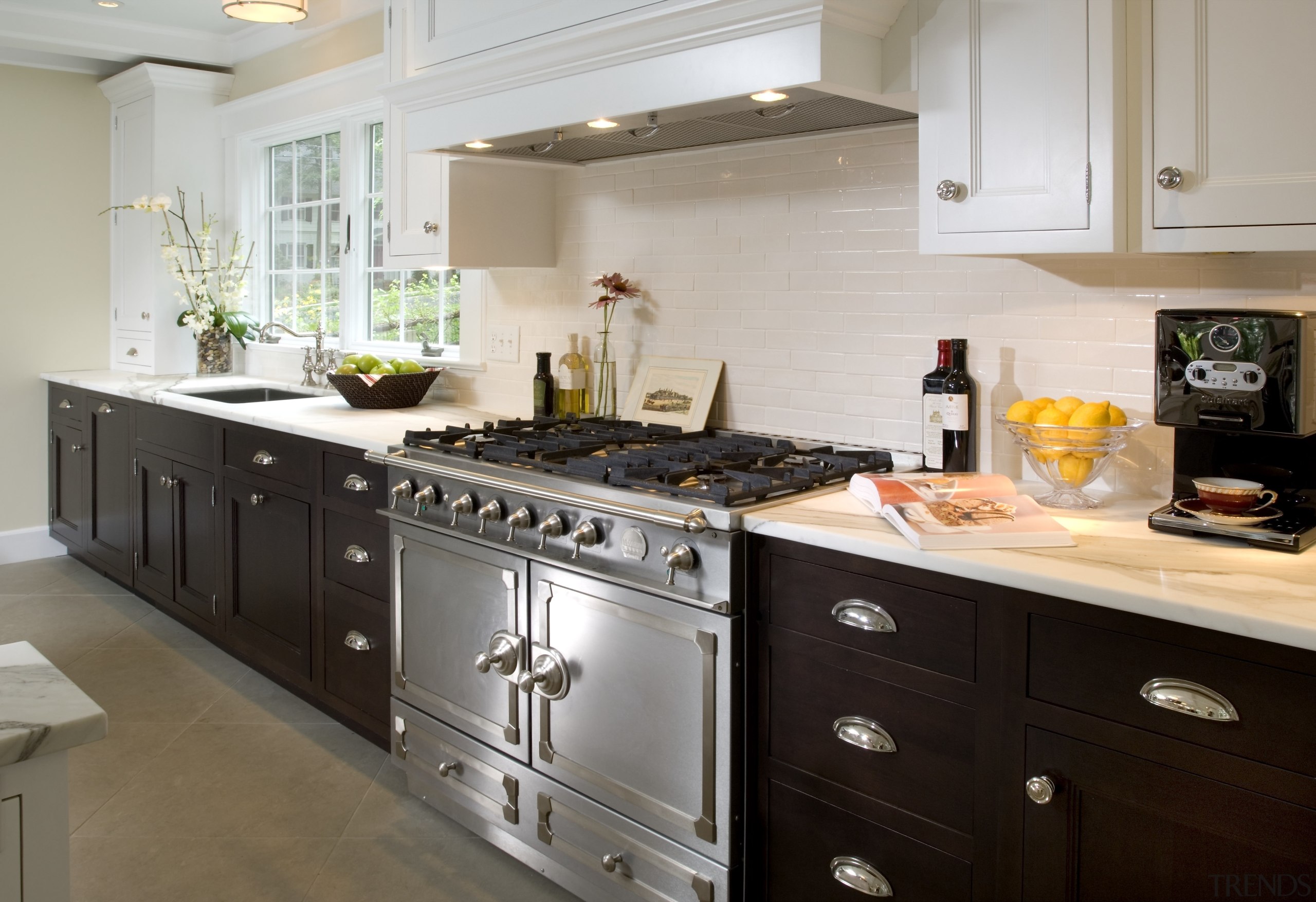 View of appliances and cabinetry in a classic cabinetry, countertop, cuisine classique, flooring, interior design, kitchen, kitchen appliance, room, gray, black