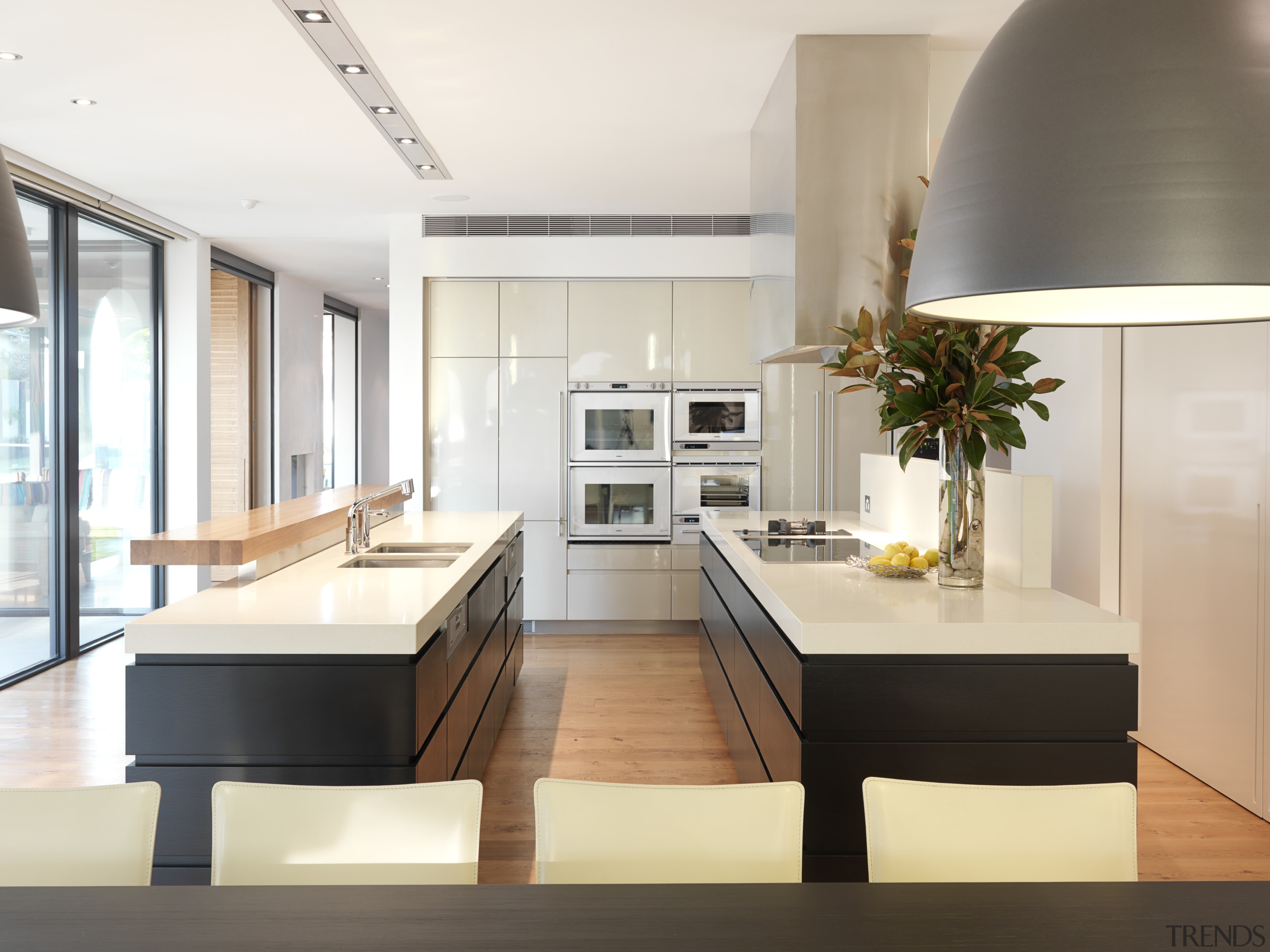 View of kitchen which features a kitchen island countertop, interior design, kitchen, white