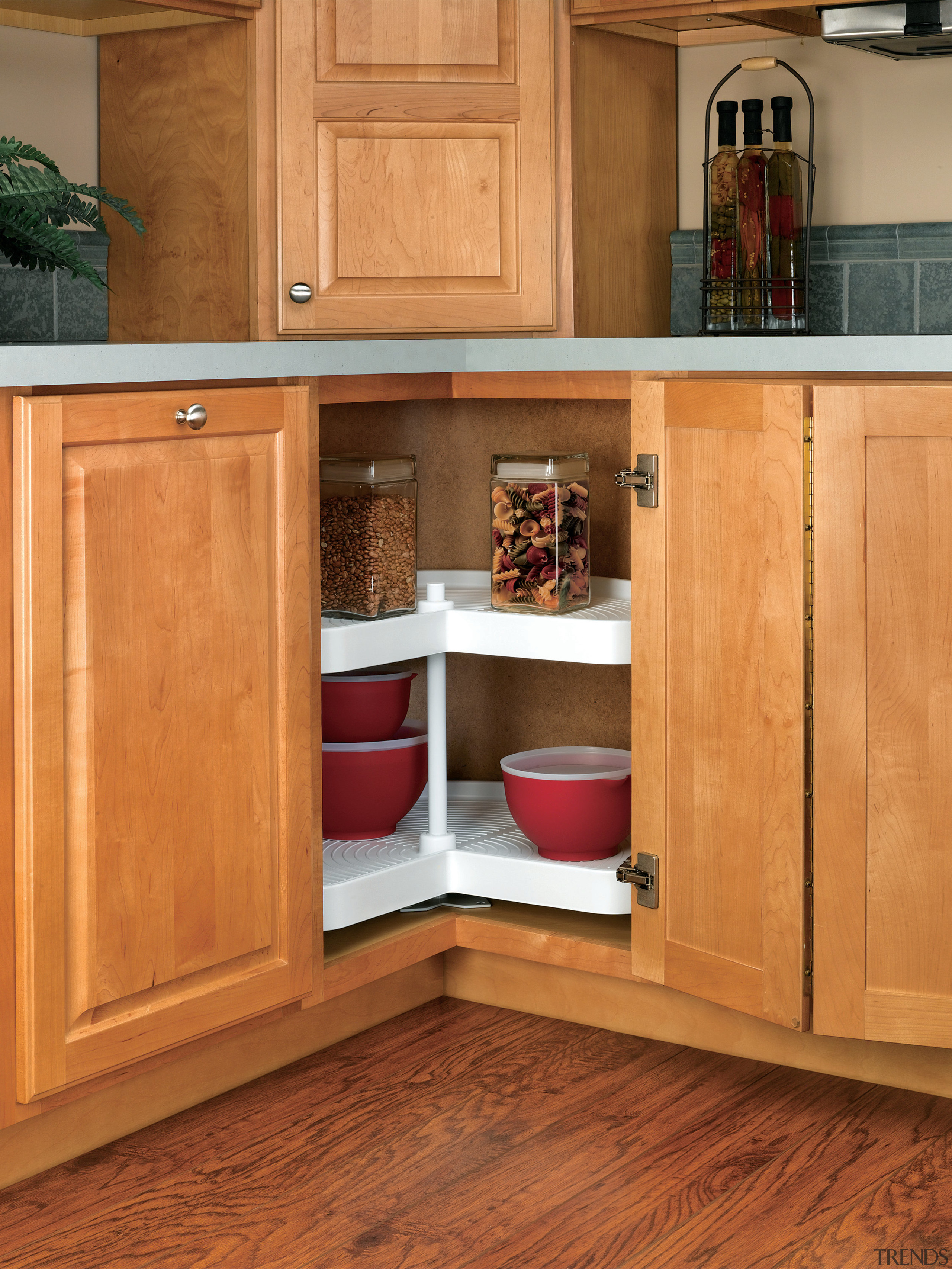 View of cabinetry which features storage systems from cabinetry, countertop, cuisine classique, cupboard, drawer, floor, flooring, furniture, hardwood, kitchen, laminate flooring, shelf, shelving, wood, wood flooring, wood stain, orange, brown