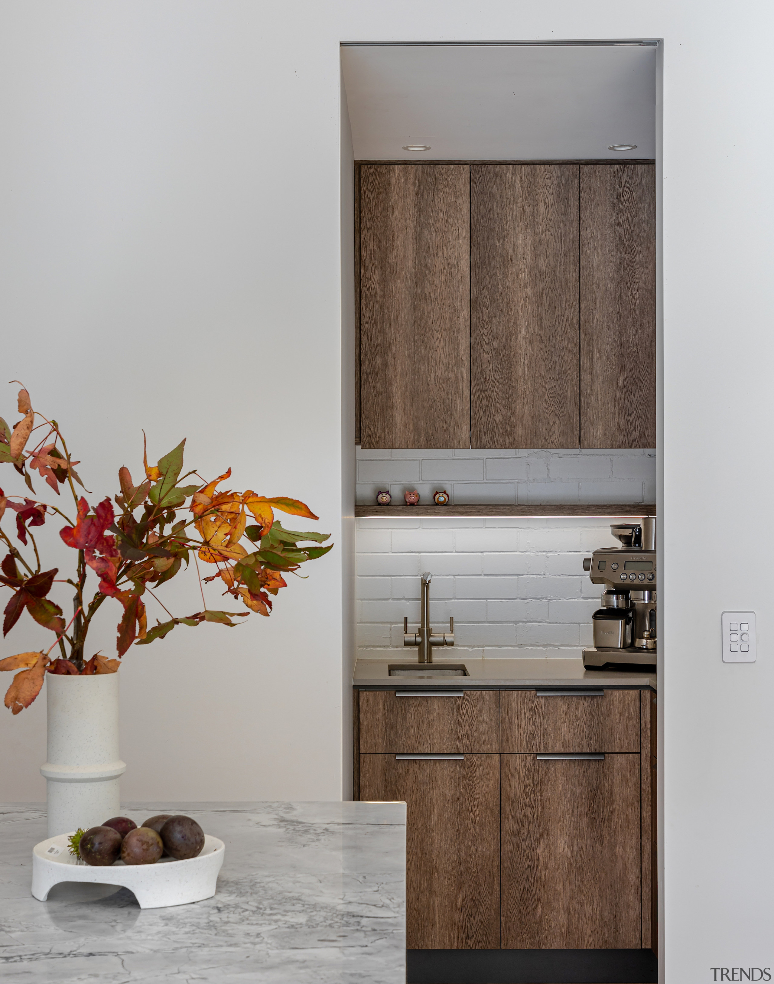 Looking into the scullery/laundry with the same cabinetry 