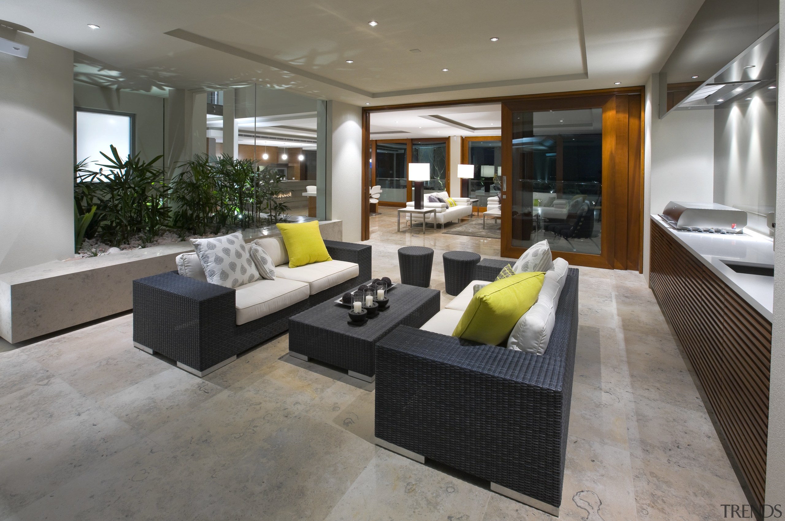 View of seating area with dark furniture in apartment, floor, flooring, house, interior design, living room, lobby, real estate, gray