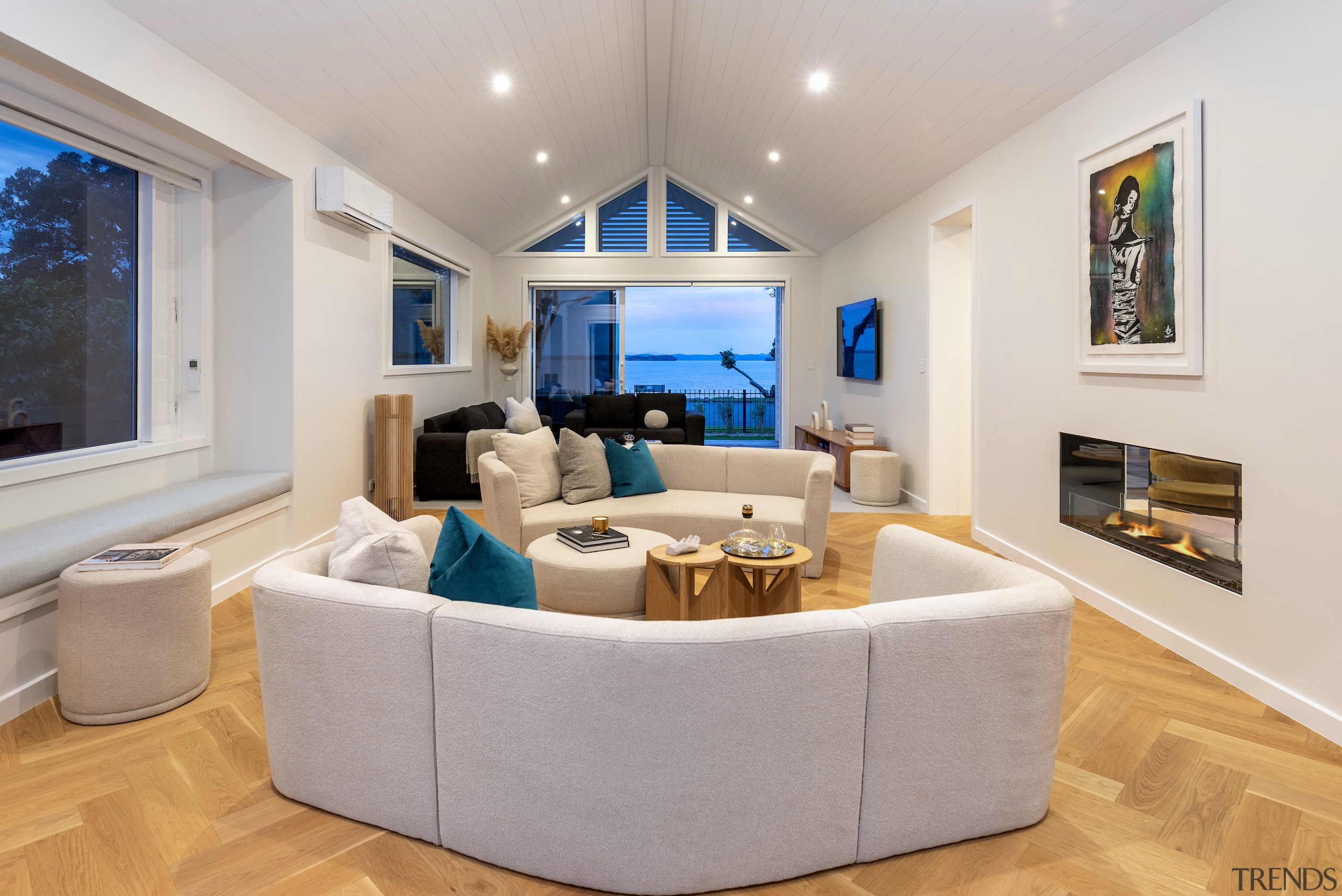 Living room showing double-sided fireplace. 