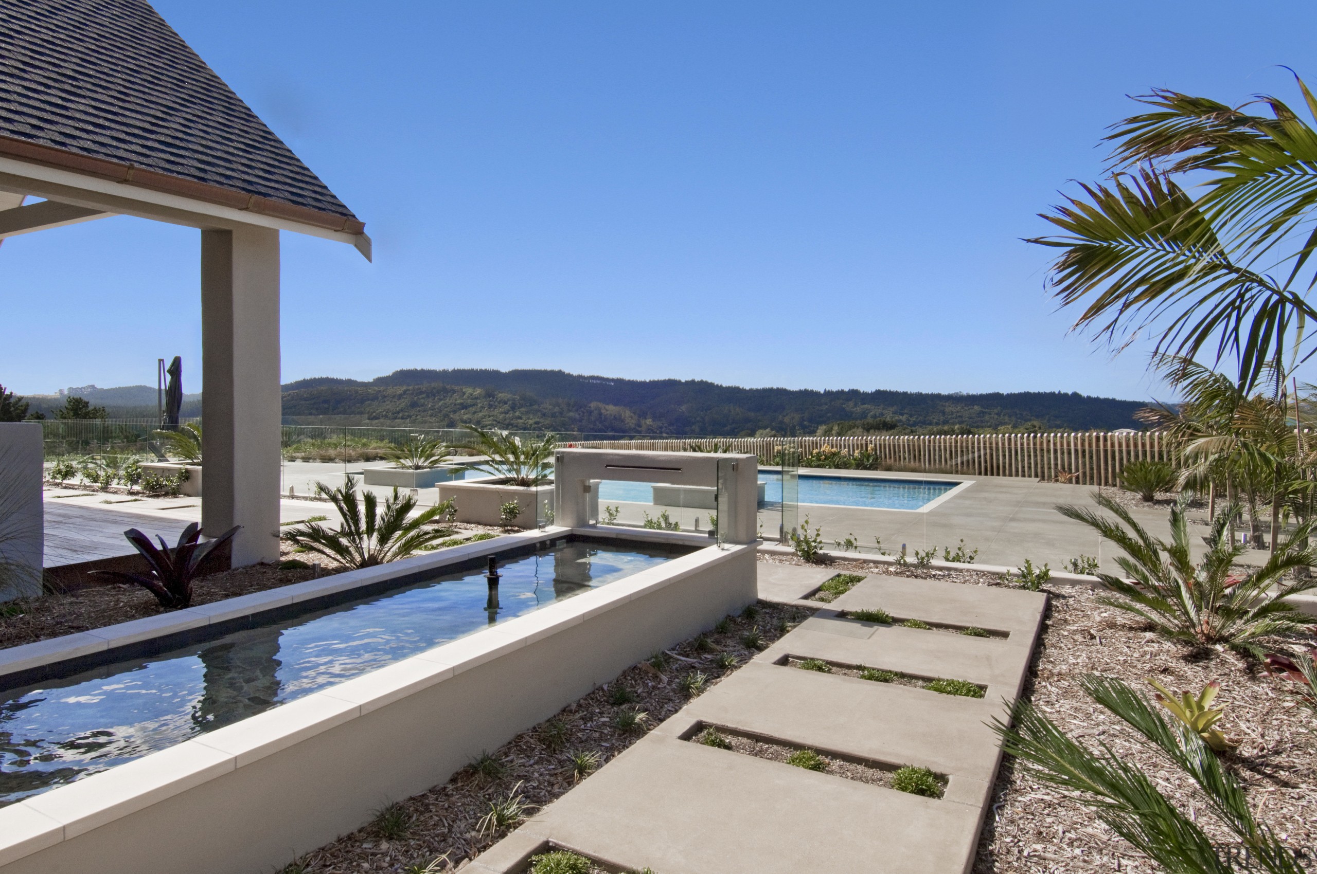 View of the outdoor area and pool of arecales, estate, home, house, leisure, palm tree, property, real estate, resort, swimming pool, villa, teal, gray