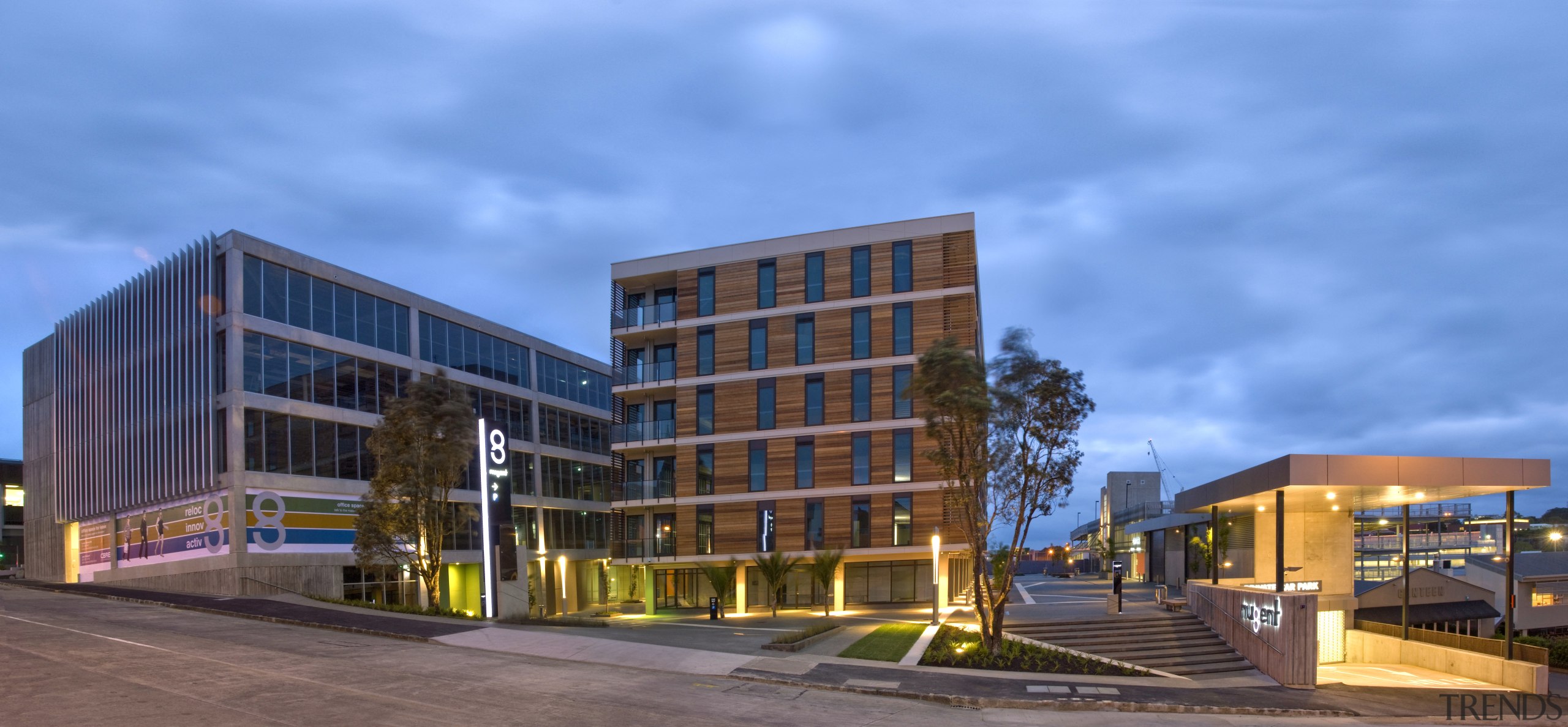 View of mixed use development at 8 Nugent. apartment, architecture, building, city, commercial building, condominium, corporate headquarters, facade, headquarters, home, metropolitan area, mixed use, neighbourhood, property, real estate, residential area, sky, teal