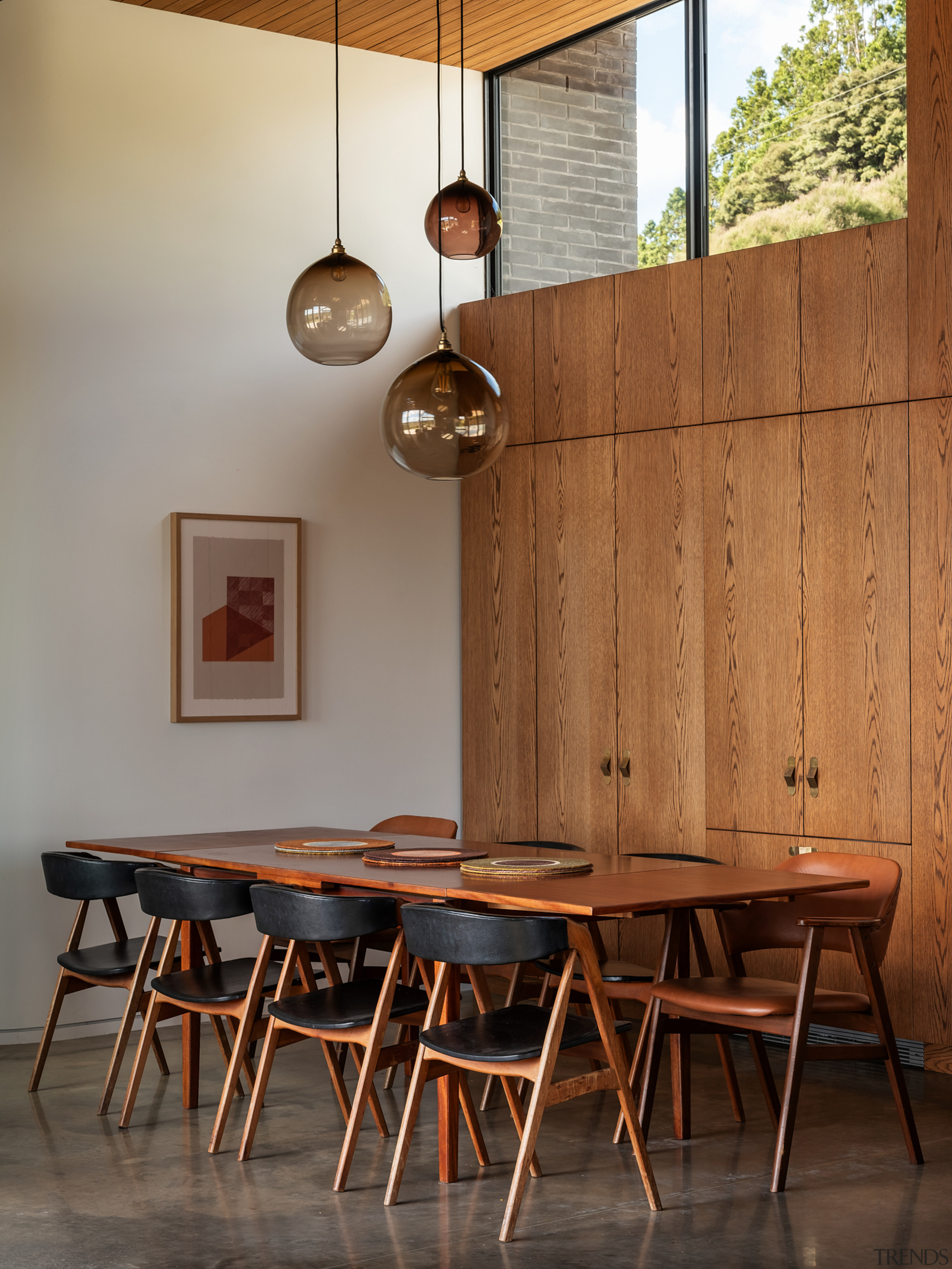 Dining space with Mid-century-look wooden table and chairs. 