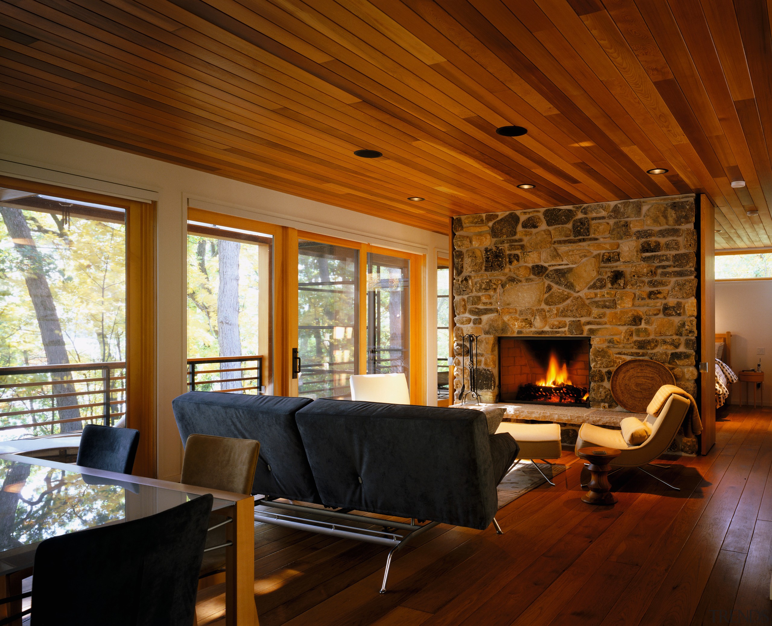 view of the living area featuring a fireplace architecture, beam, ceiling, fireplace, floor, flooring, hardwood, home, house, interior design, living room, log cabin, real estate, room, wall, window, wood, wood flooring, brown