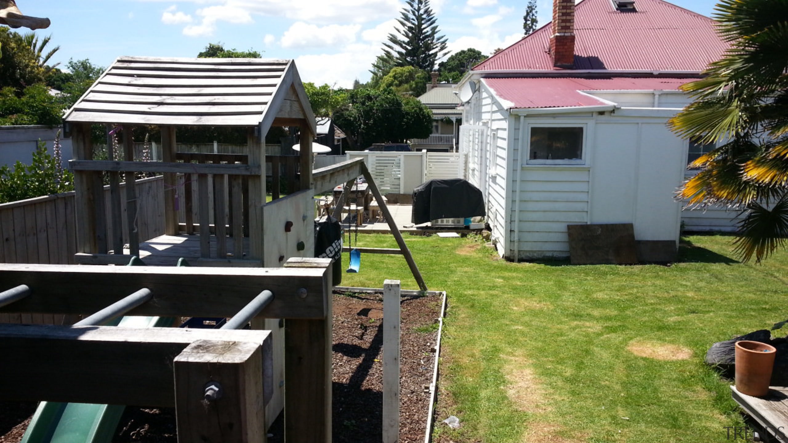 This small lean-to added decades after the 1920s backyard, cottage, home, house, outdoor structure, property, real estate, roof, shed, siding, yard, black