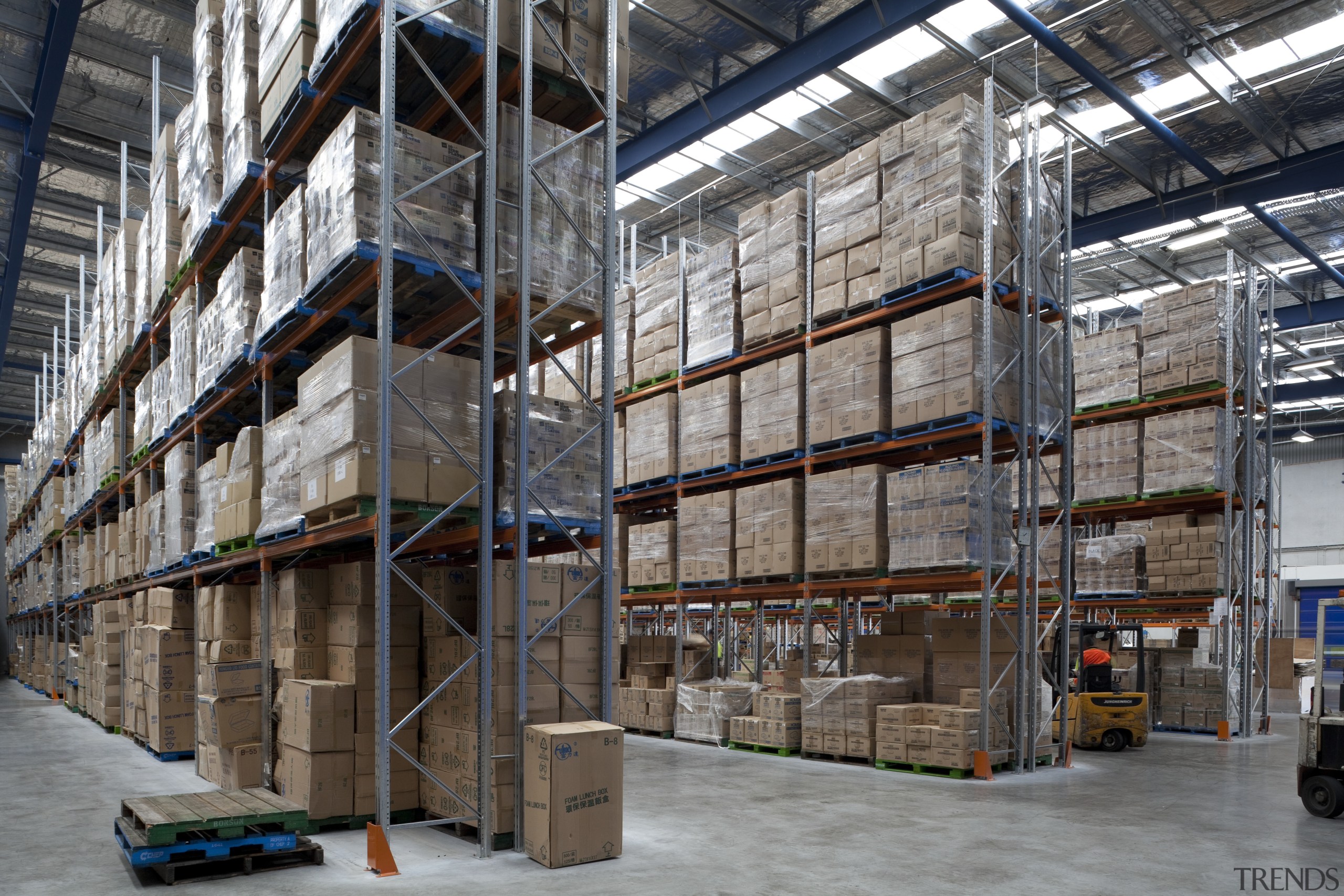 View of boxes in factory. - View of building, industry, inventory, warehouse, gray, black